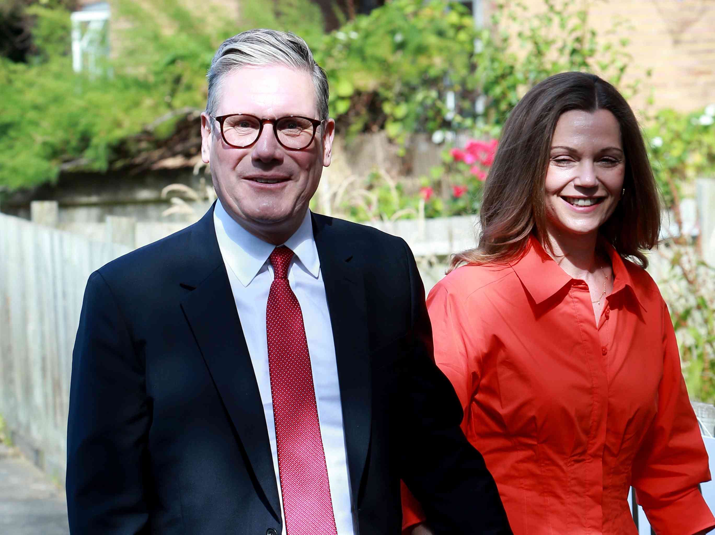 Keir Starmer and his wife. background