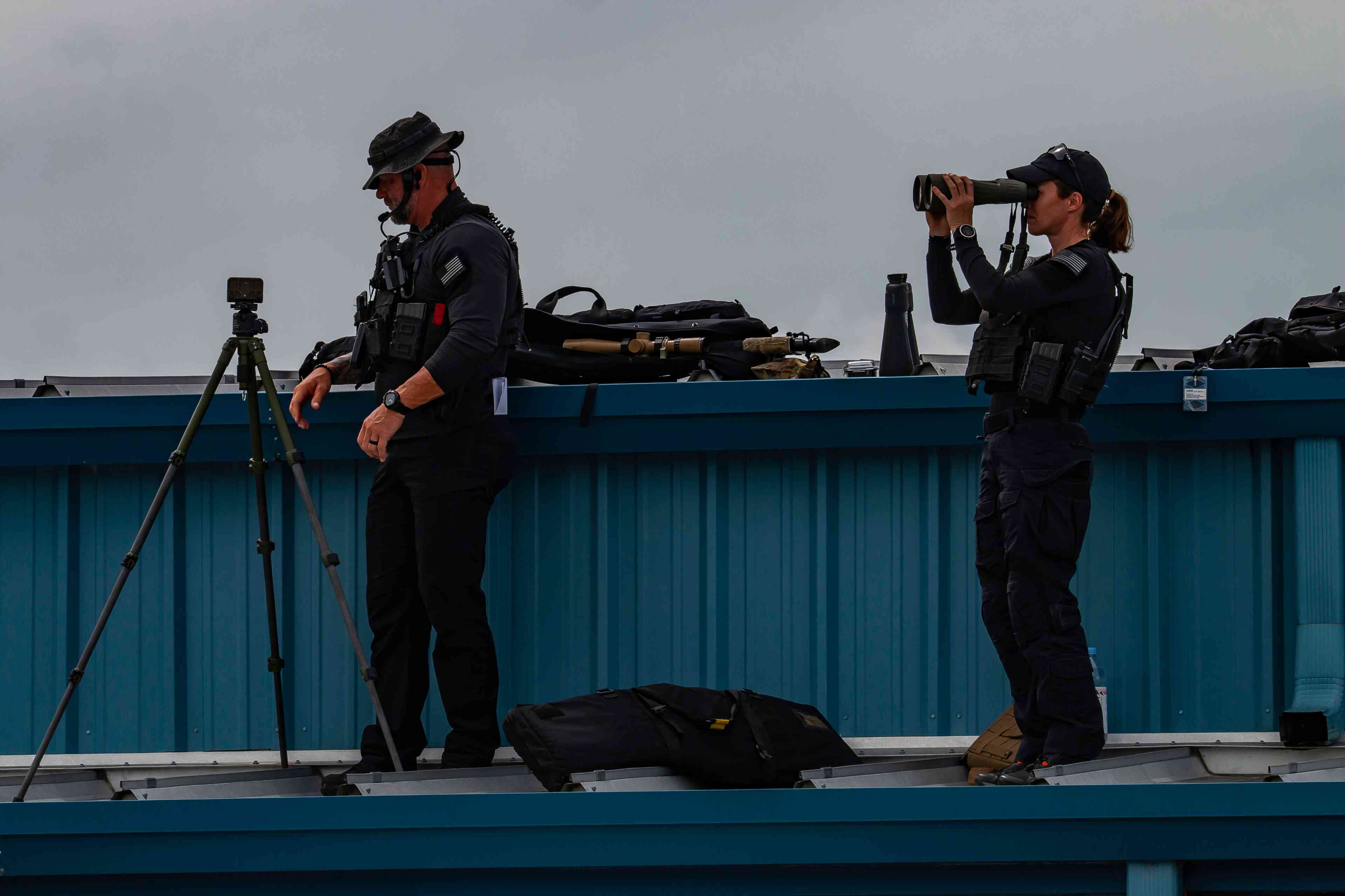 A pair of Secret Service snipers background