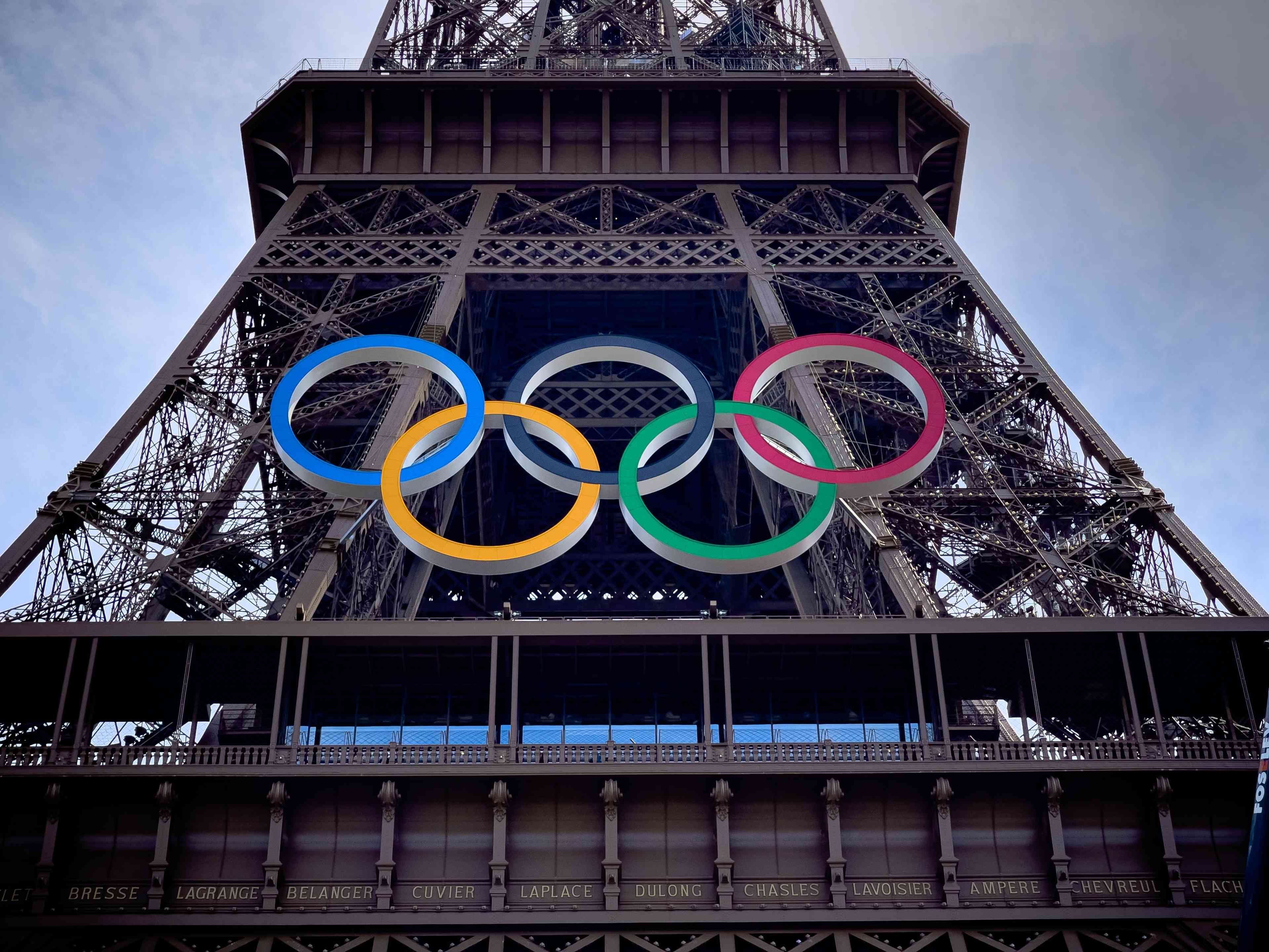 PARIS, FRANCE - JUNE 8 2024: The Olympic Rings installed on the Eiffel Tower ahead of the Paris 2024 Olympic Games background