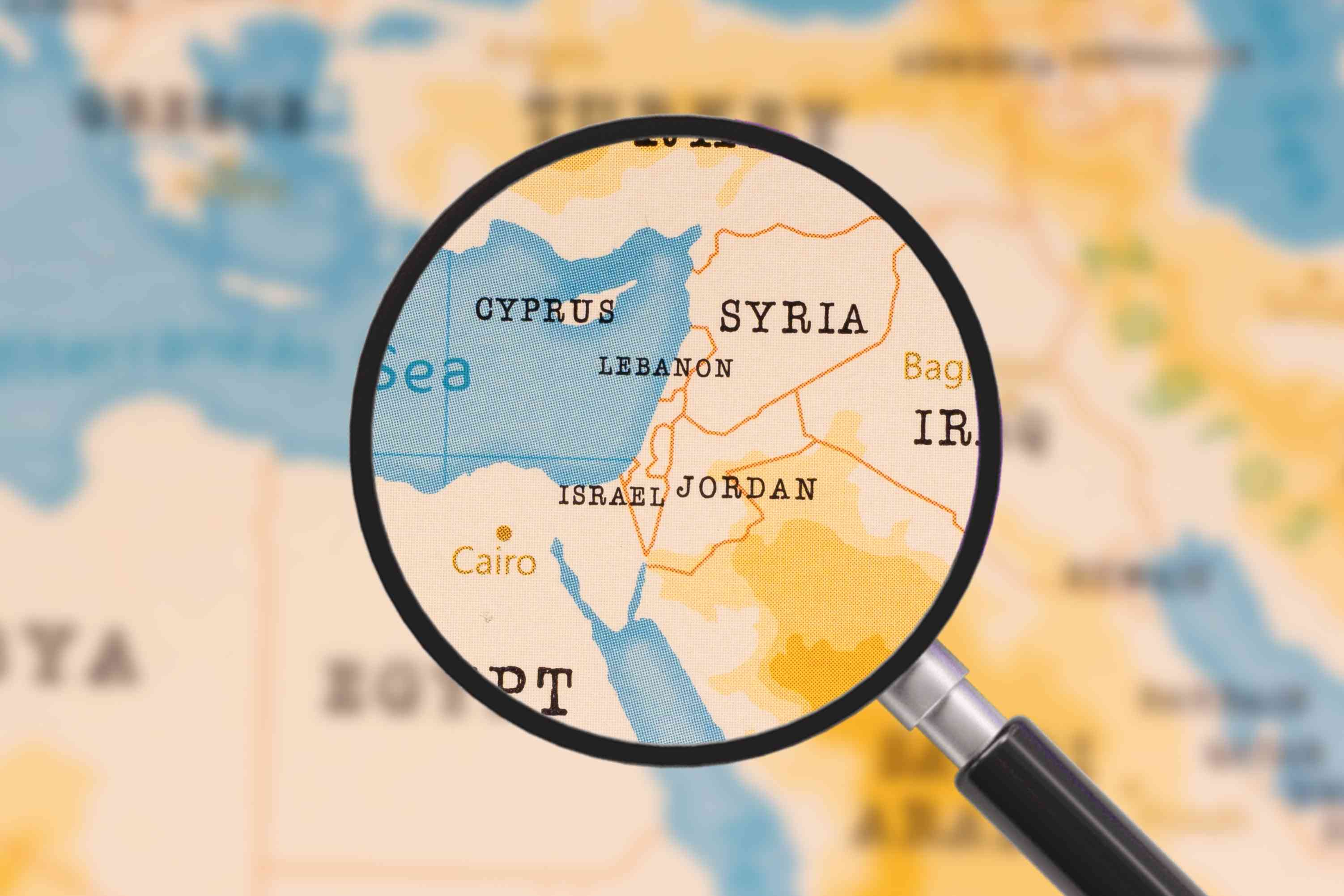 A magnifying glass on Lebanon, Israel and Jordan background