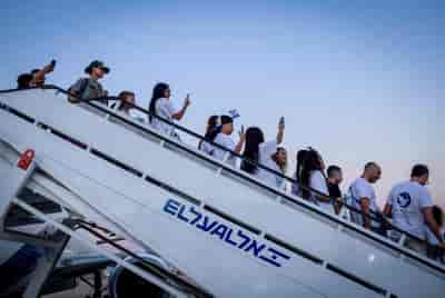 New immigrants from France arrive at the Ben Gurion airport in central Israel on August 1, 2024. background