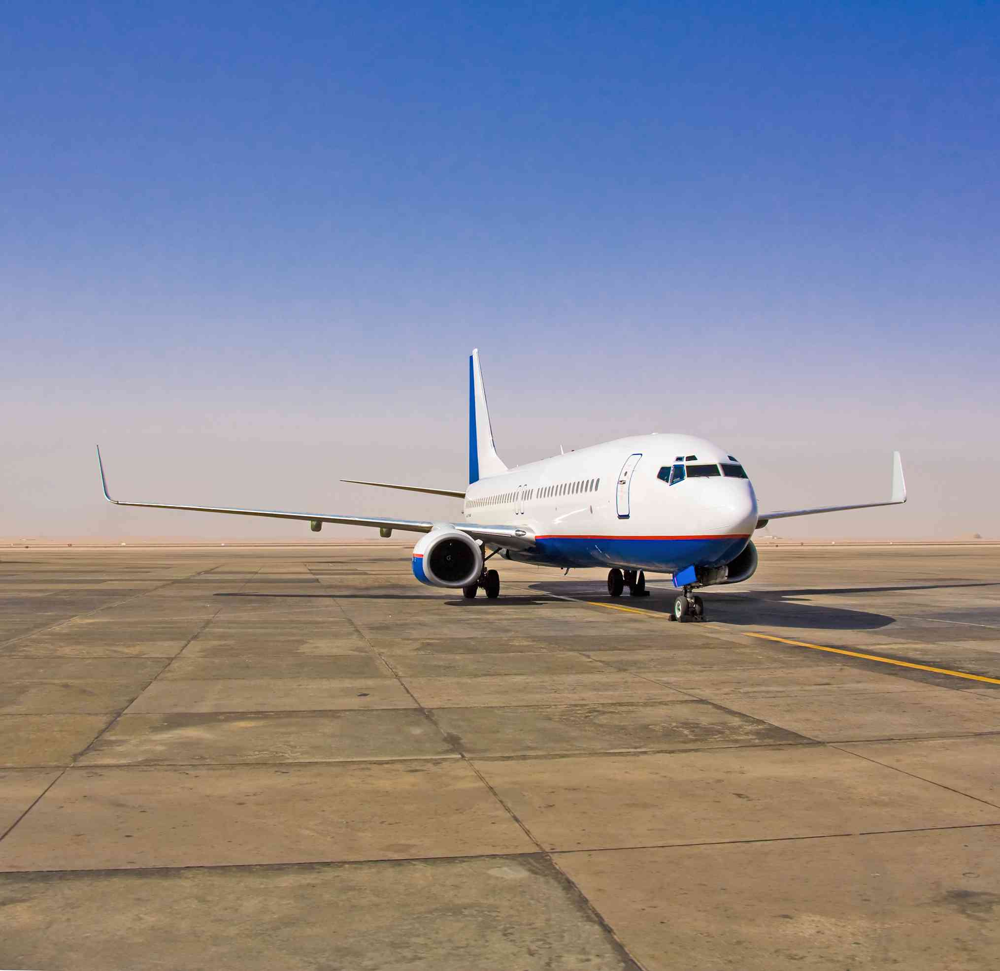 Plane on tarmac background