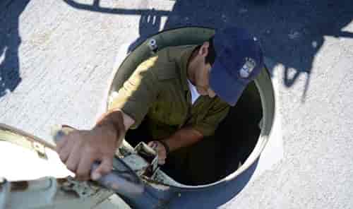 Israeli soldier in the Navy background