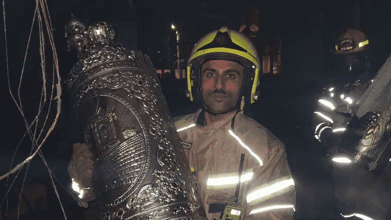 Fireman with Torah scroll background