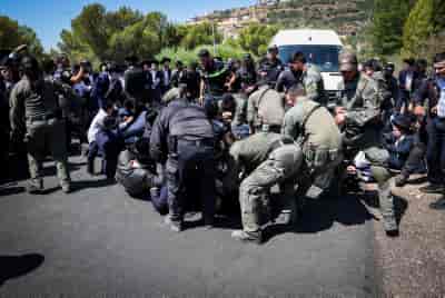 Ultra orthodox Jews clash with police during a protest against the drafting of ultra orthodox jews to the Israeli army background