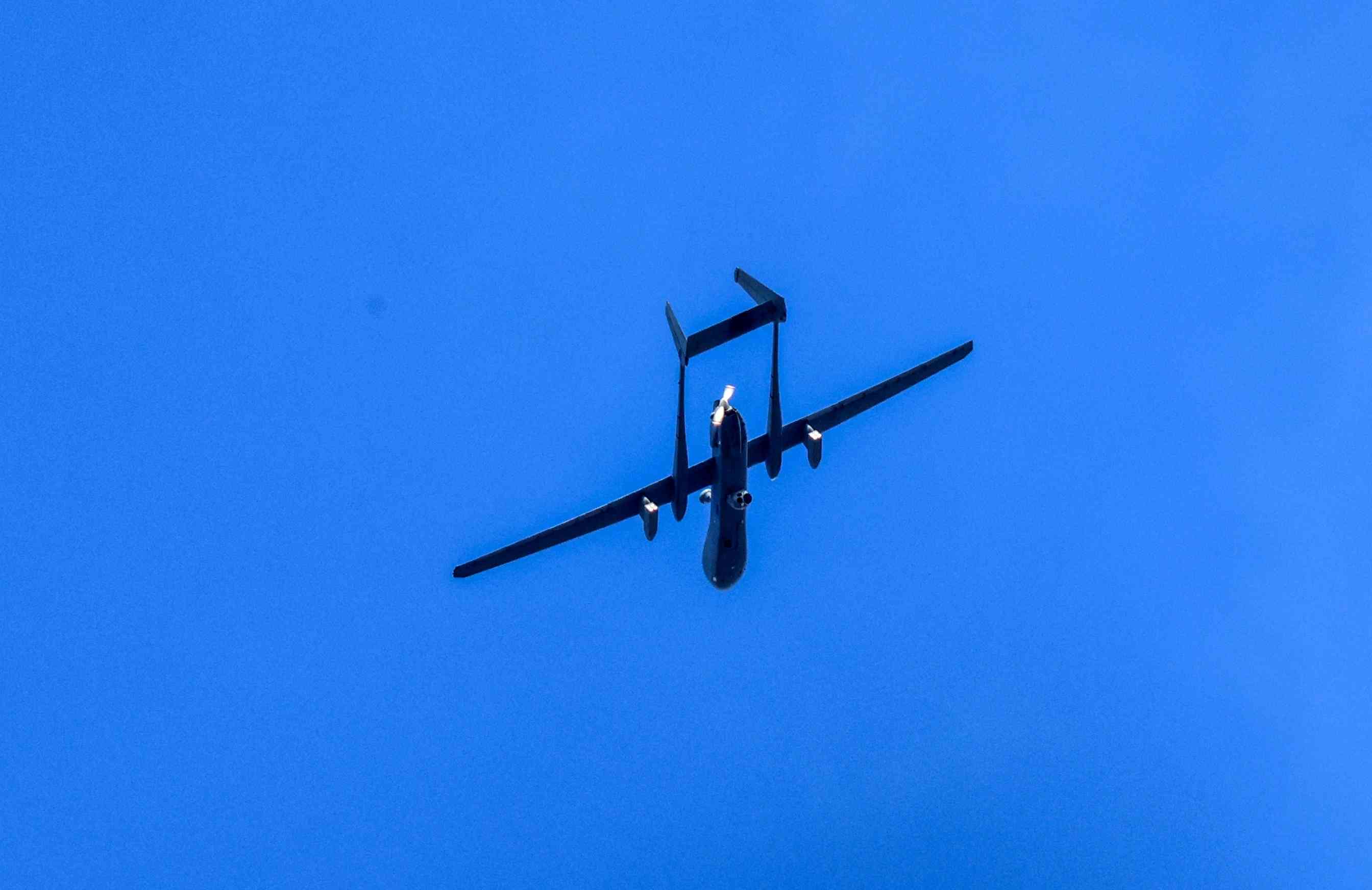 An Israeli military drone flies over Rafah in the southern Gaza Strip, on January 03, 2024 background