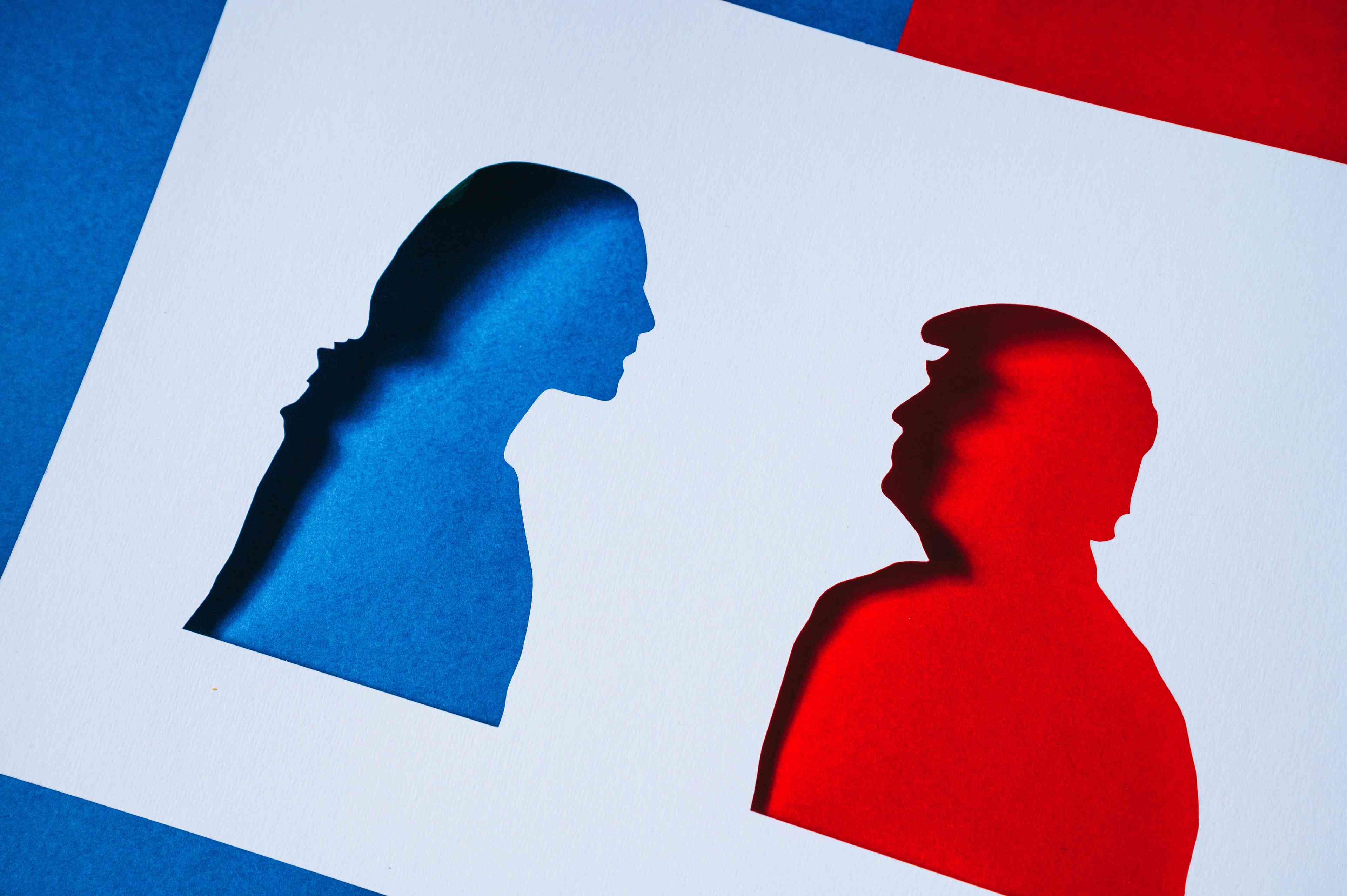 Kamala Harris and Donald Trump Papercut Silhouettes background