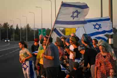 Israelis gather with national flags at 100 locations nationwide to strengthen the country's unity, Hispin, Golan Heights, on August 8, 2024. background