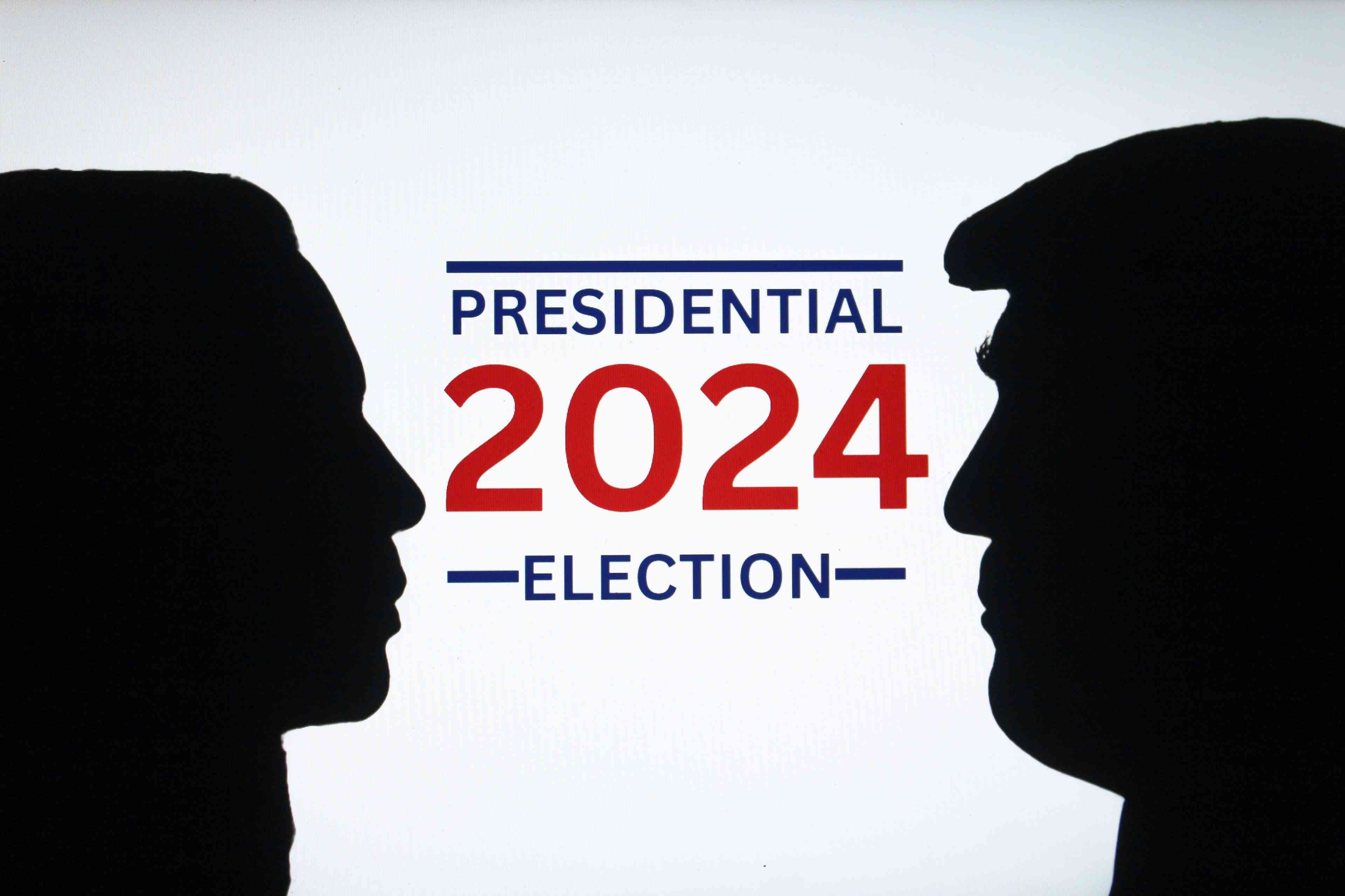 Silhouettes of ex-president Donald Trump and vice president Kamala Harris background