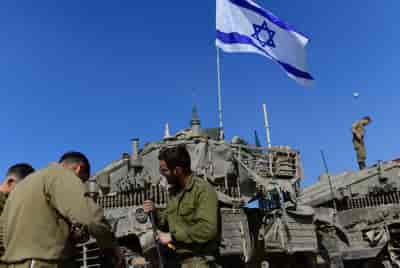 IDF forces at a staging area in southern Israel near the border with Gaza background