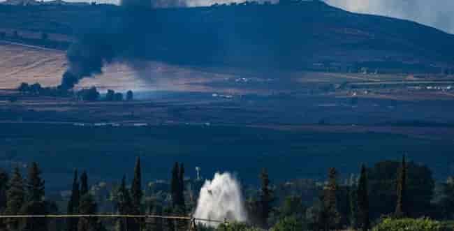 Smoke rises near the border between Israel and South Lebanon background
