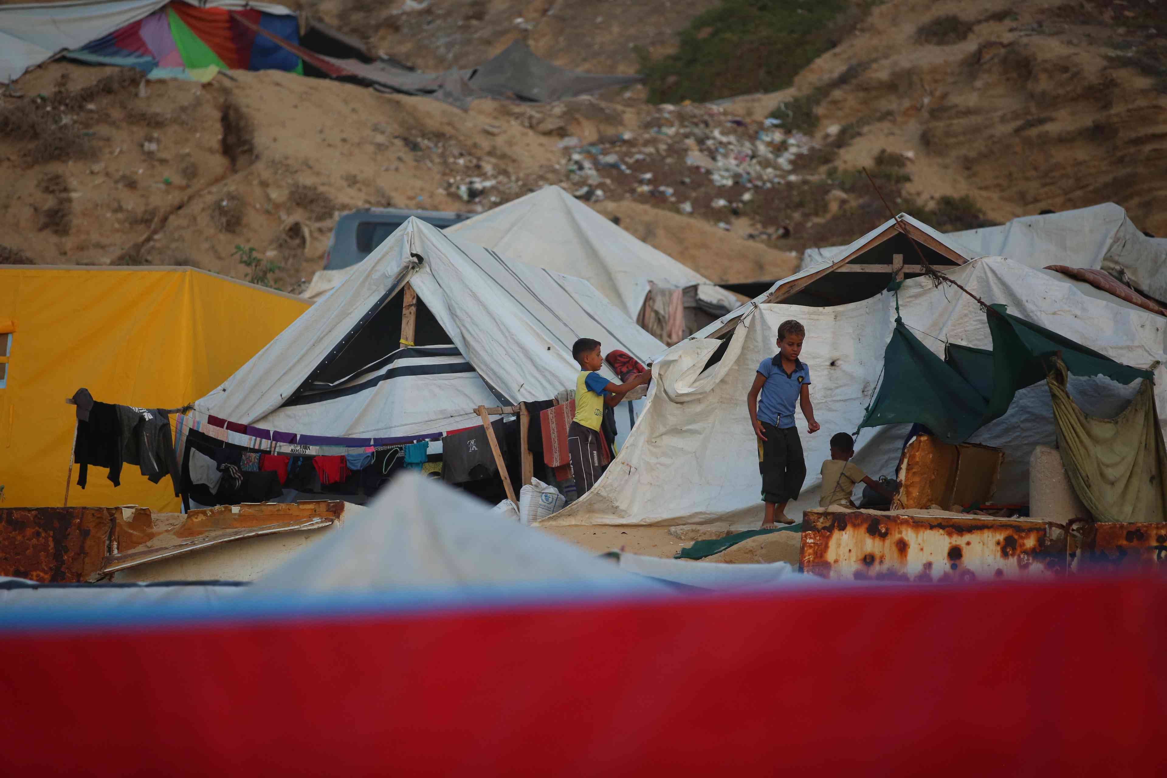 Displaced Palestinians in Deir al-Balah, in the central Gaza Strip, on September 20, 2024 background