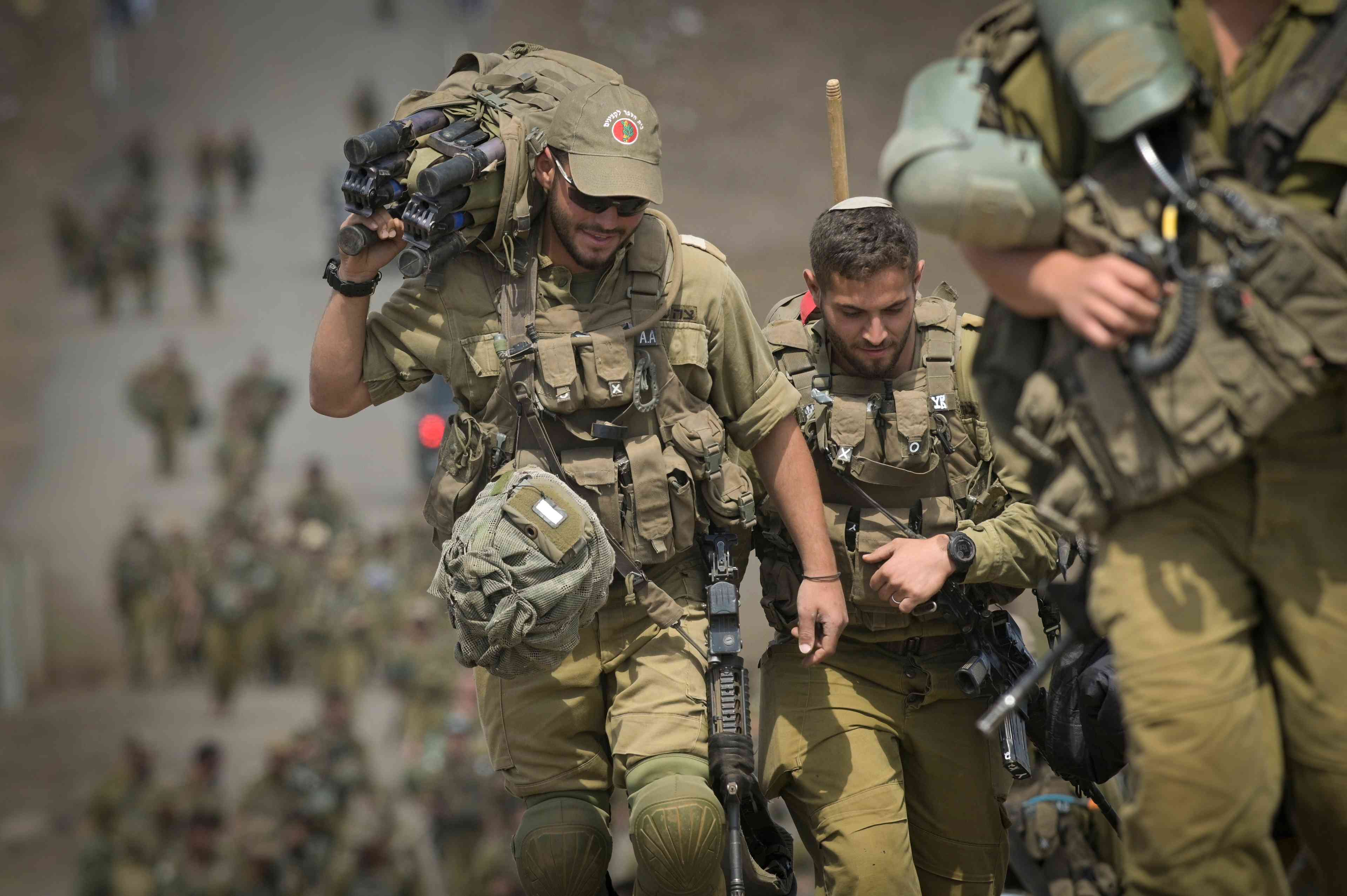 sraeli soldiers seen after a military training in the Golan Heights, on April 19, 2024.  background