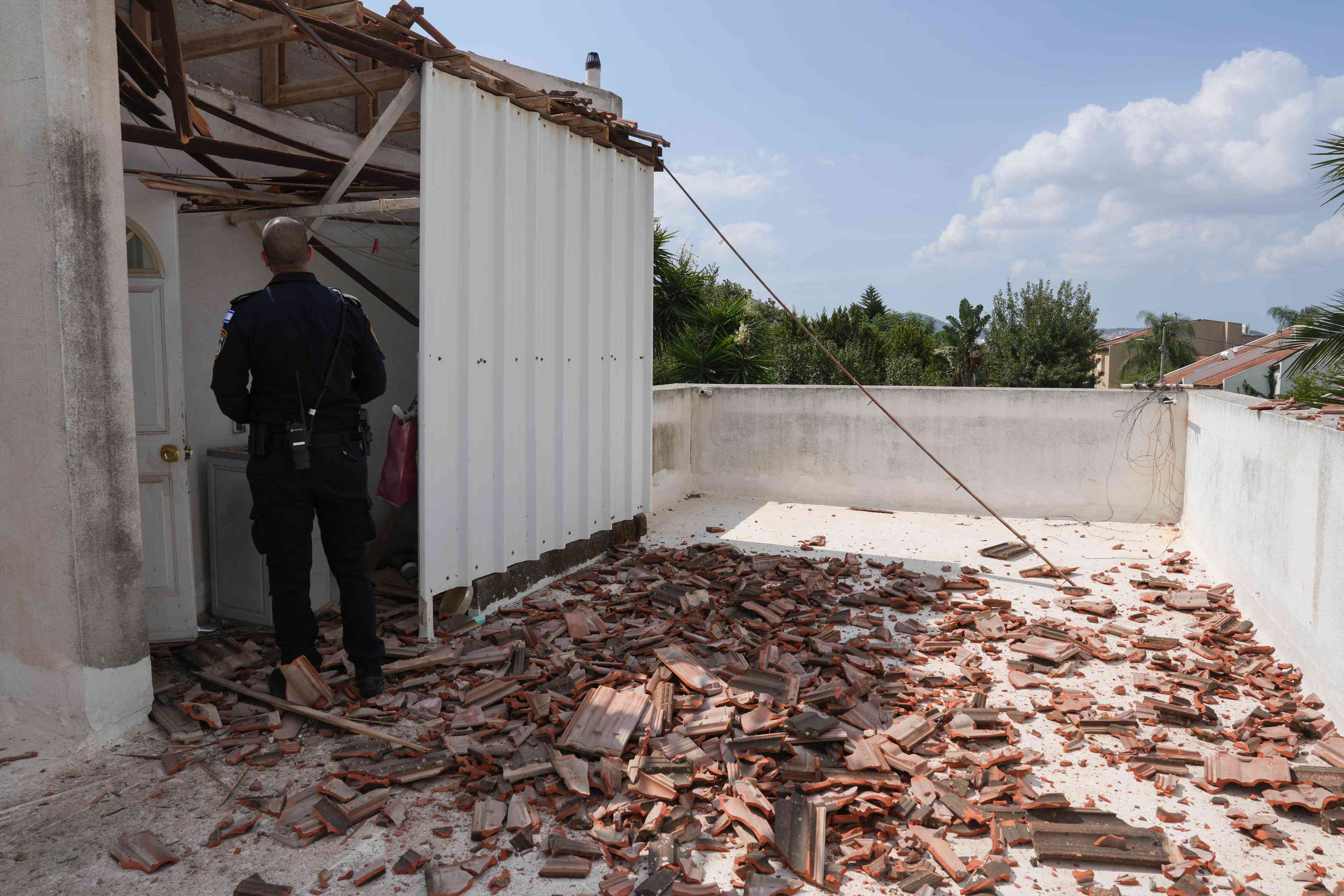 The site where a missile fired from Lebanon hit a house in Giv'at Avni, northern Israel, September 23, 2024. background