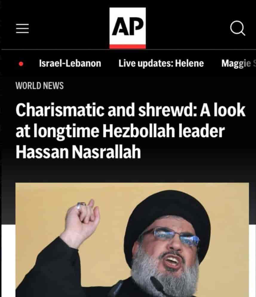 Photo of mobile version of AP, referrign to a terrorist in positive terms background
