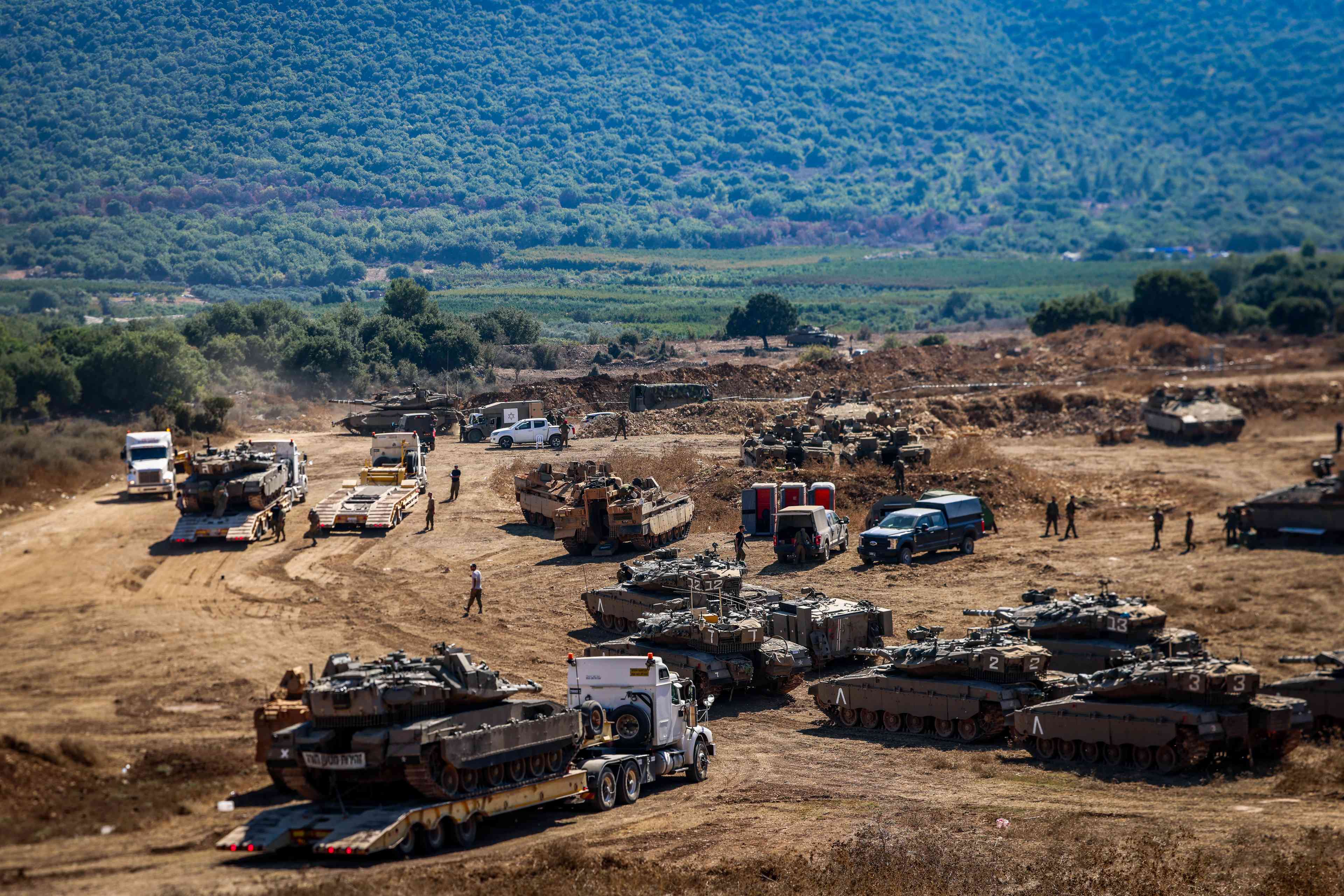 Israeli soldiers seen at a staging area near the Israeli border with Lebanon, September 29, 2024. background