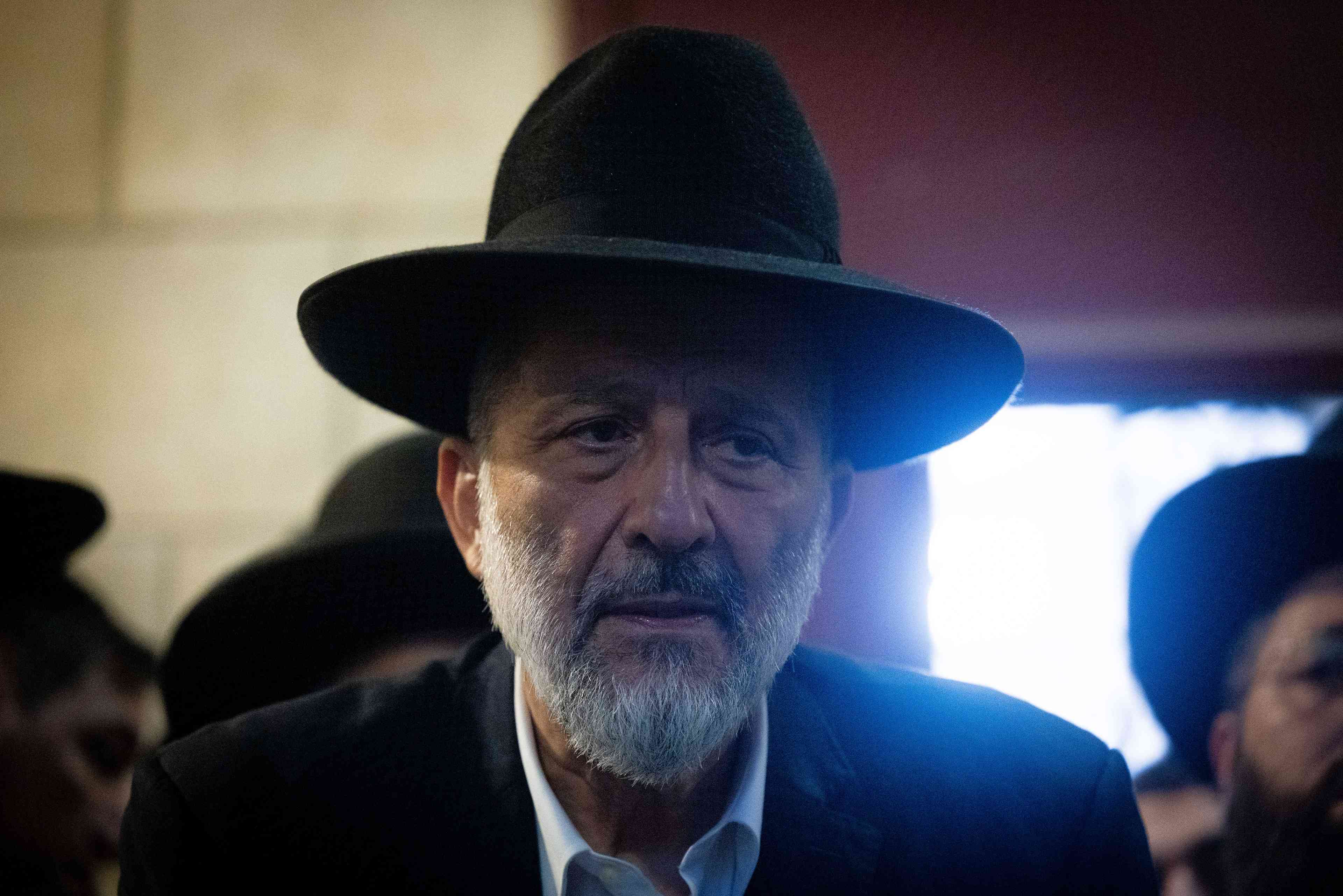 Shas leader Aryeh Deri. background