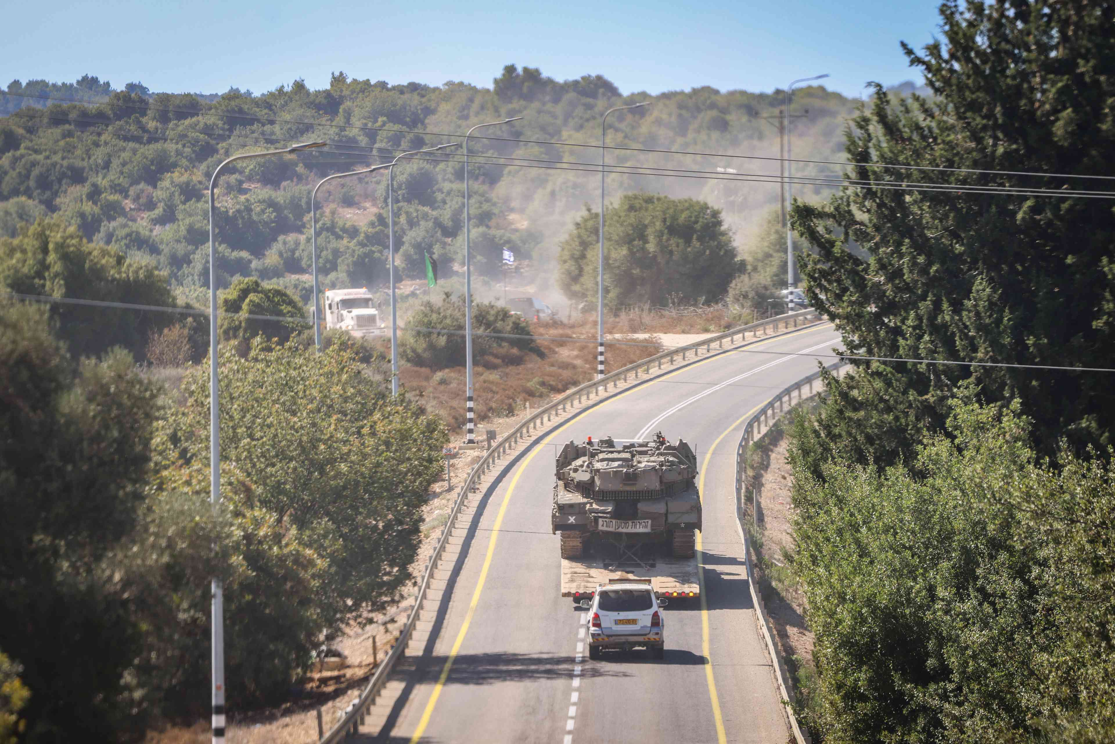 Israeli soldiers seen at a staging area near the Israeli border with Lebanon, September 29, 2024. background