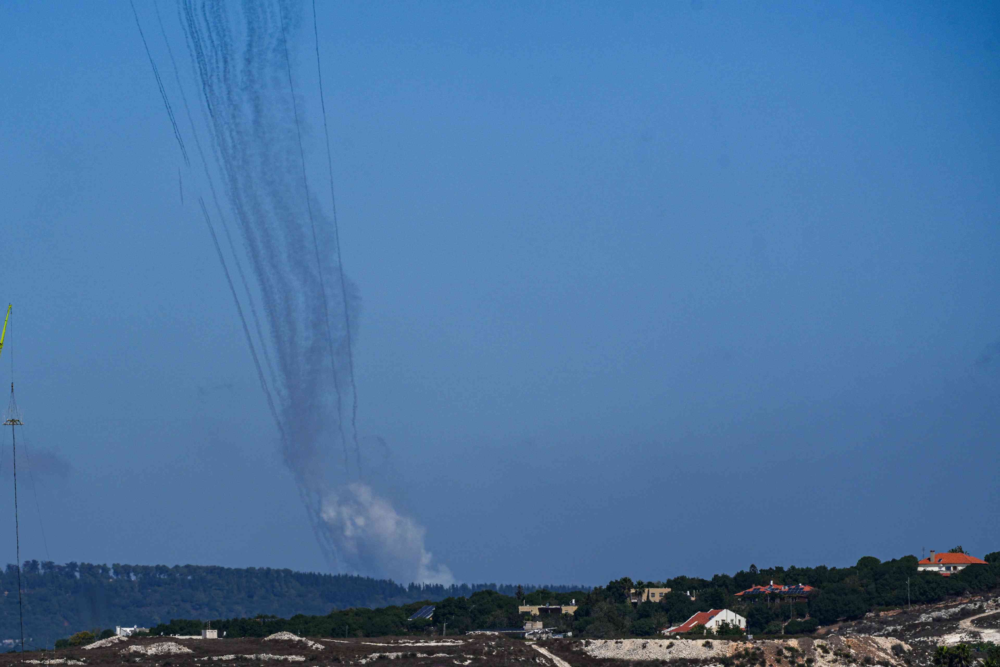 Missiles launched from southern Lebanon towards Israel, as it seen from the Israeli side of the border background