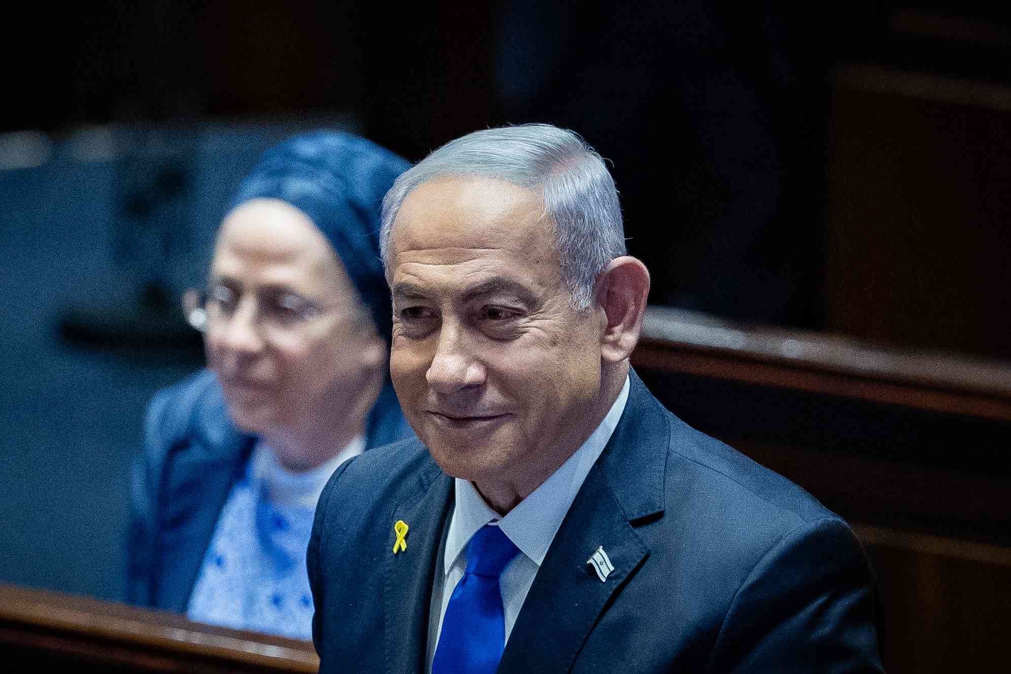 Reason to smile? Prime Minister Binyamin Netanyahu. background