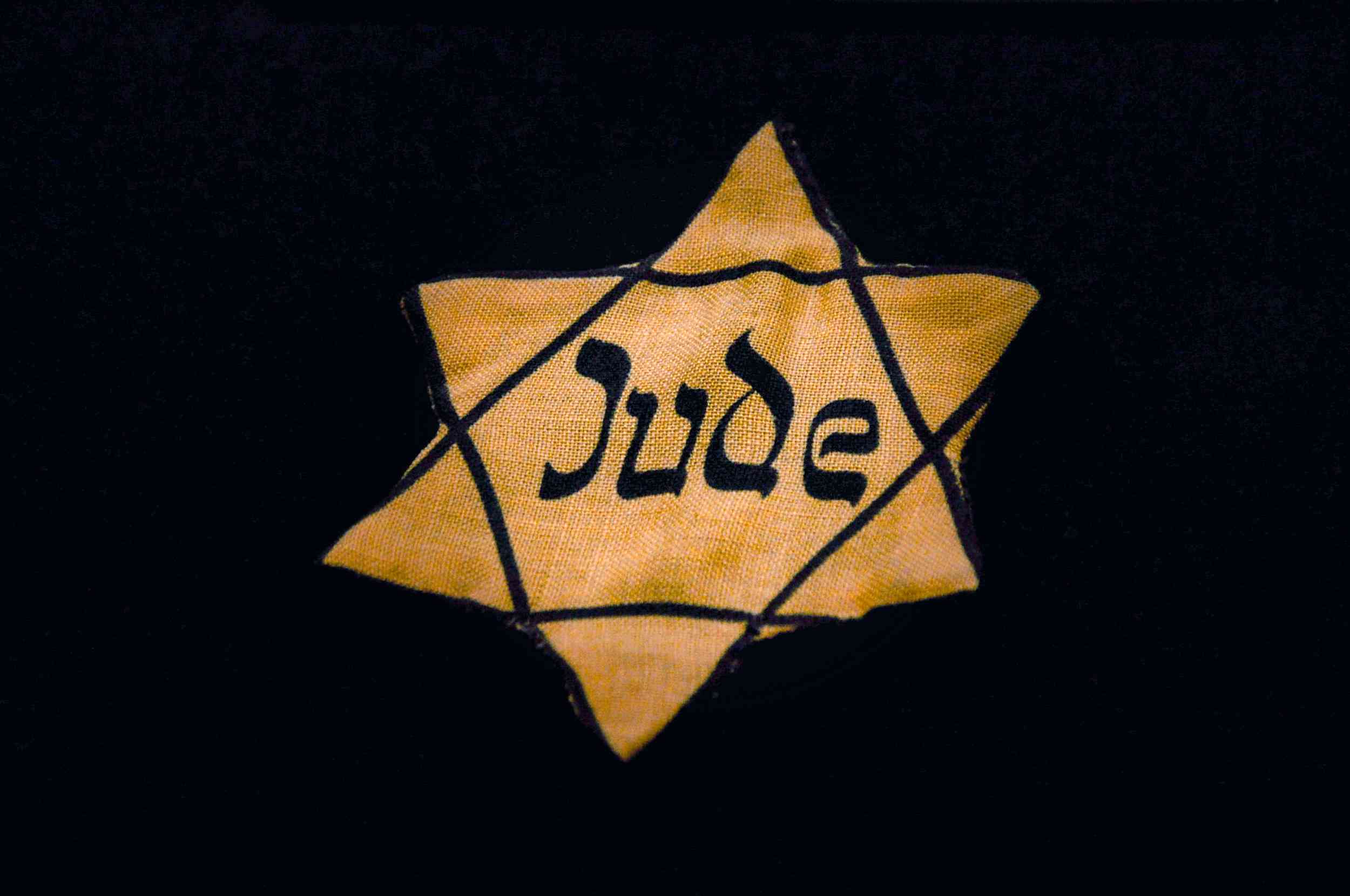 Yellow star worn by Jews during the Nazi era background