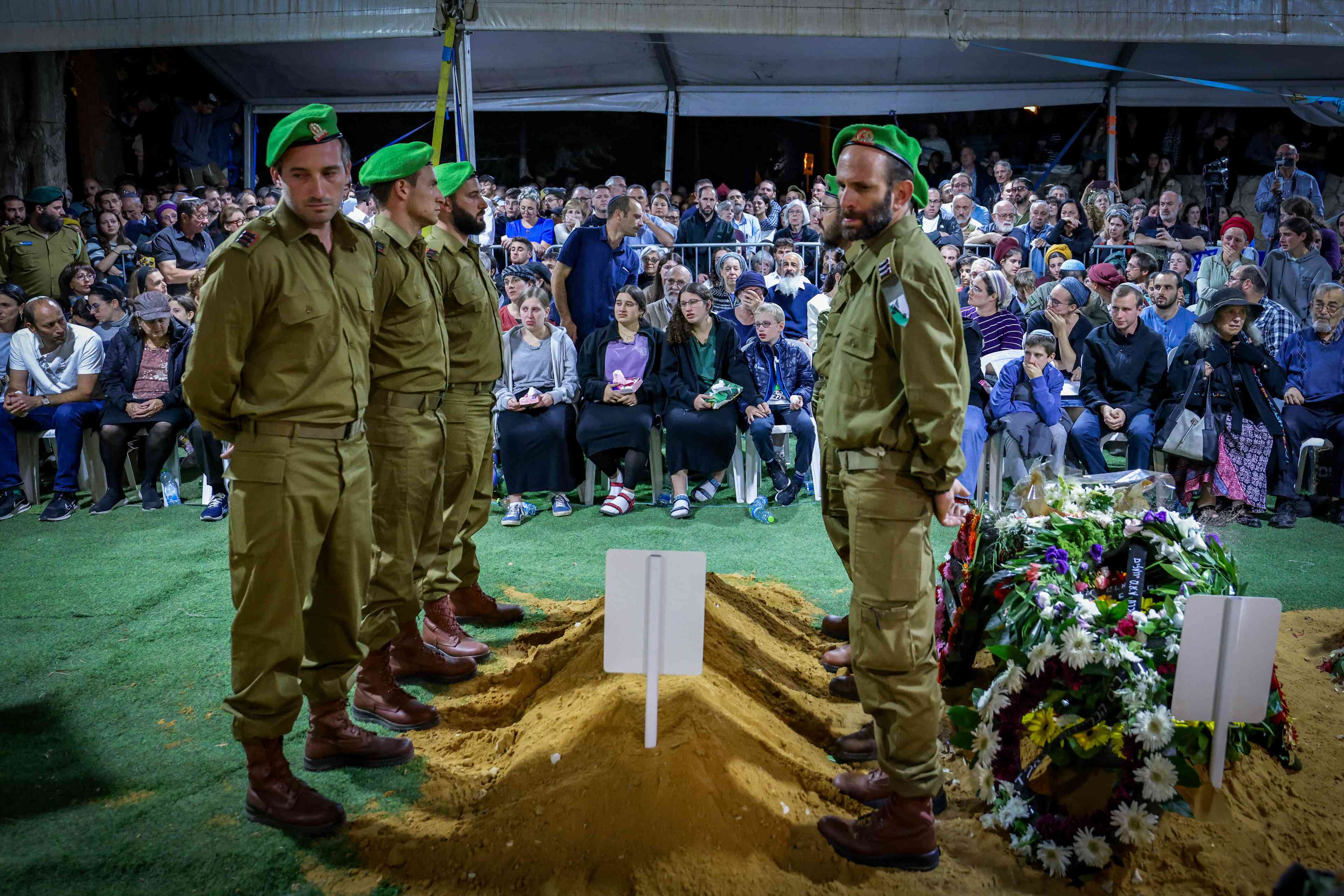 Family and friends of Israeli soldier Captain (res.) Avraham Yosef Goldberg, attend his funeral at Mount Herzl Military Cemetery in Jerusalem on October 27, 2024. He fell in battle in southern Lebanon. background