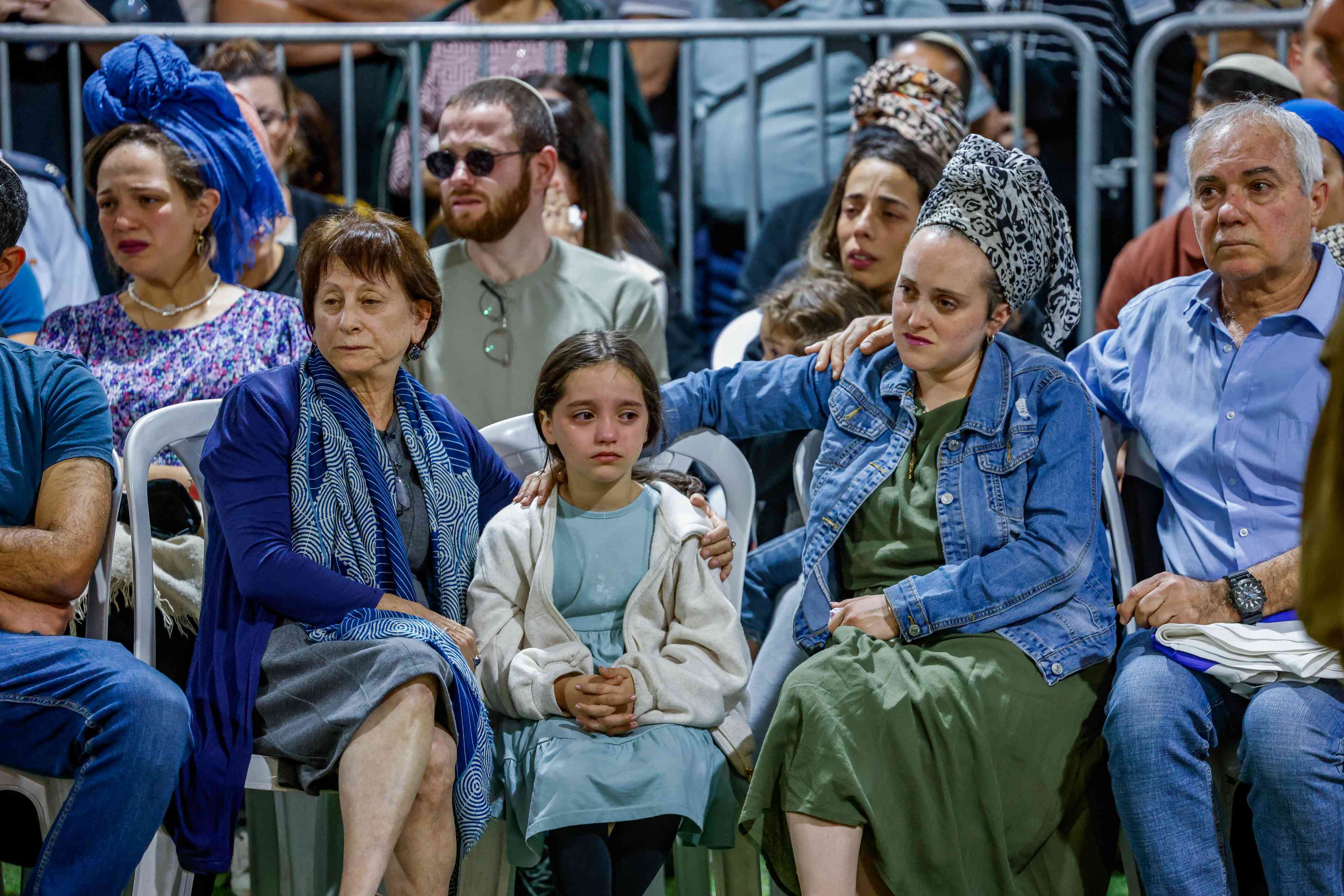 Family and friends of Israeli soldier Master sergeant (res.) Gilad Elmaliach, attend his funeral at Mount Herzl Military Cemetery in Jerusalem on October 27, 2024. He fell in battle in southern Lebanon background