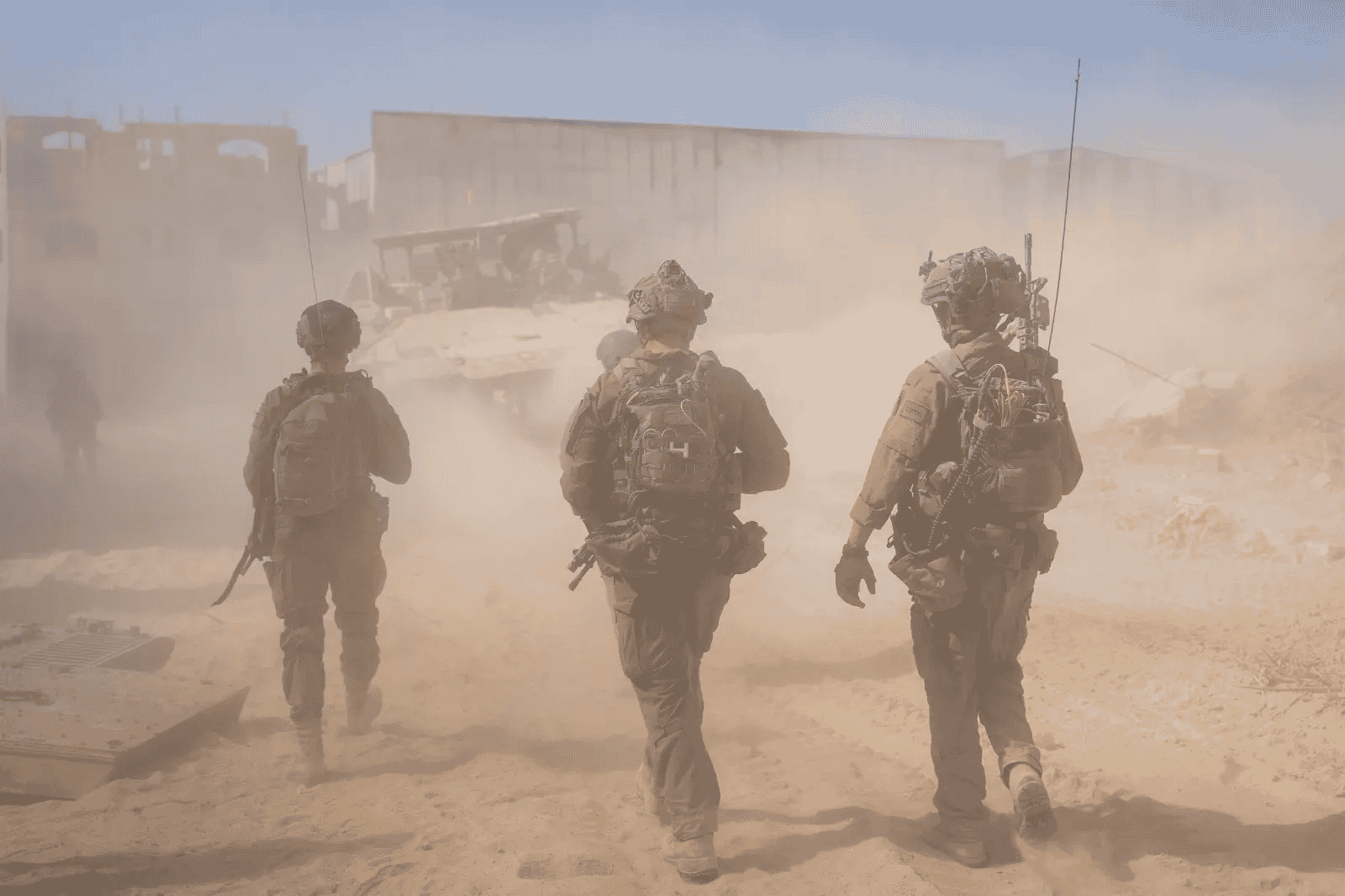 IDF soldiers in Gaza background
