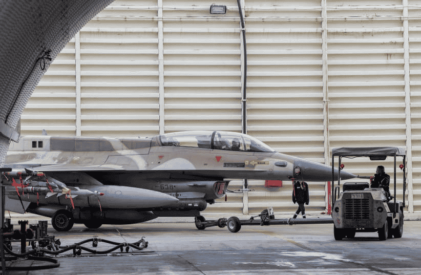 Israeli air force technicians working on a F-16 Fighting Falcon in Ramat David Airbase, northern Israel, January 14, 2024. background