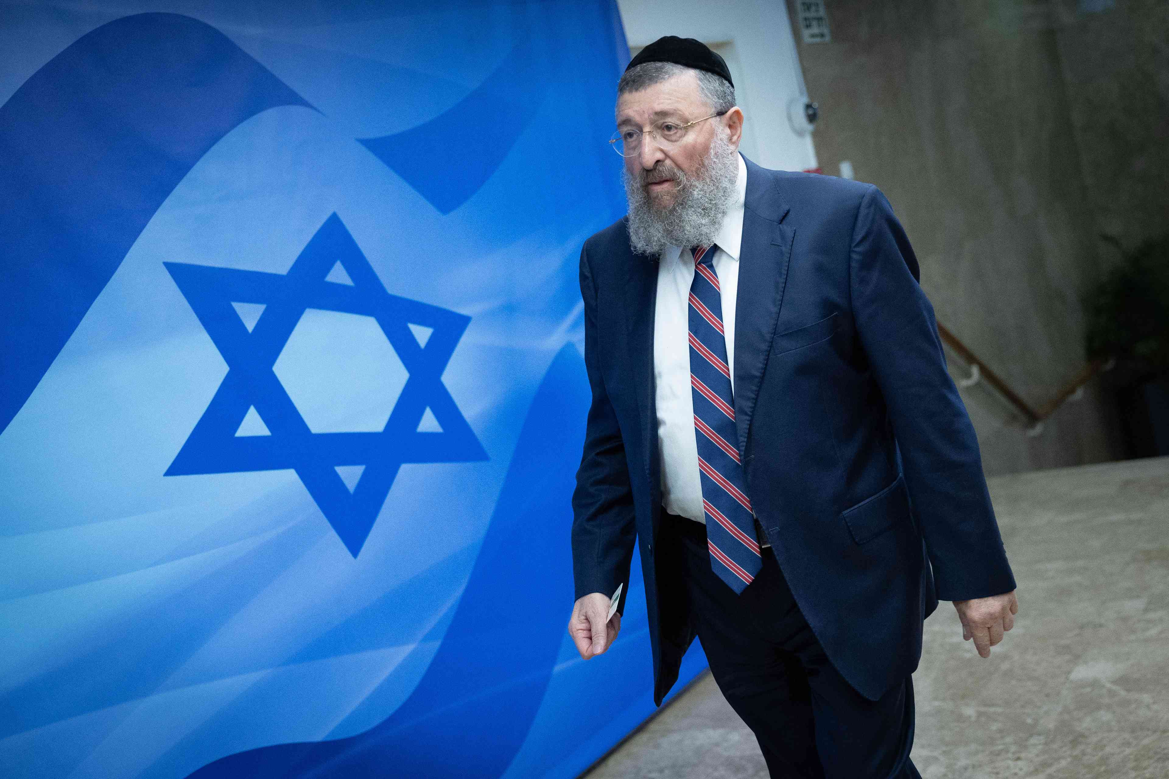Labor Minister Yoav Ben Tzur. background