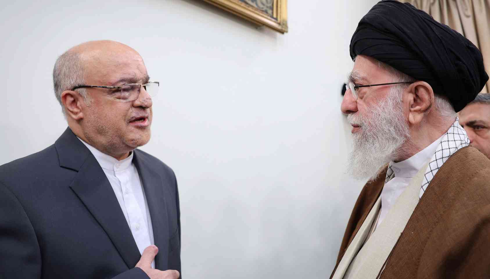 Motjaba Amani and Khamenei background