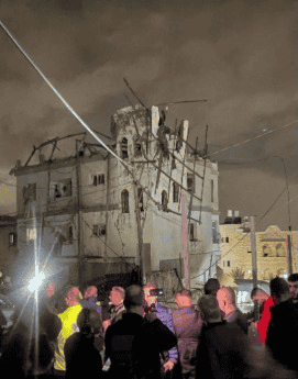 Ruins of building hit by Hezbollah rocket. background