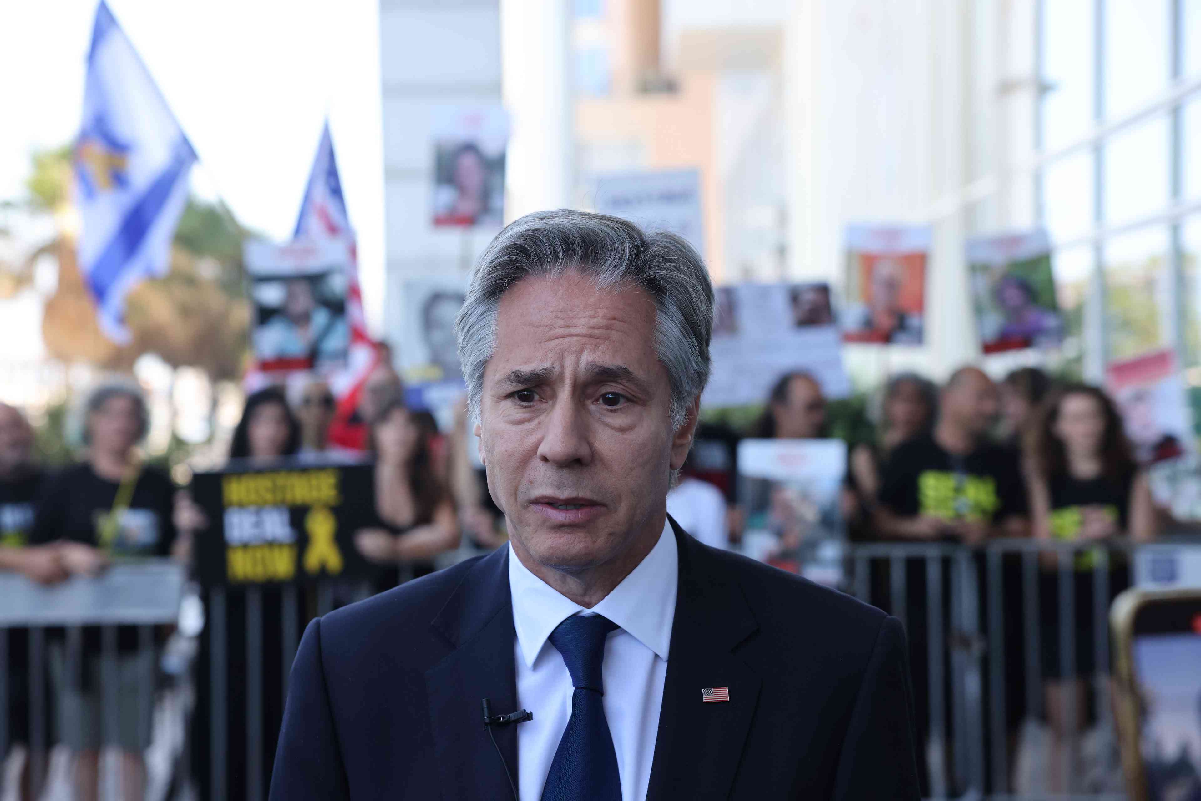 Secretary of State Anthony Blinken. background