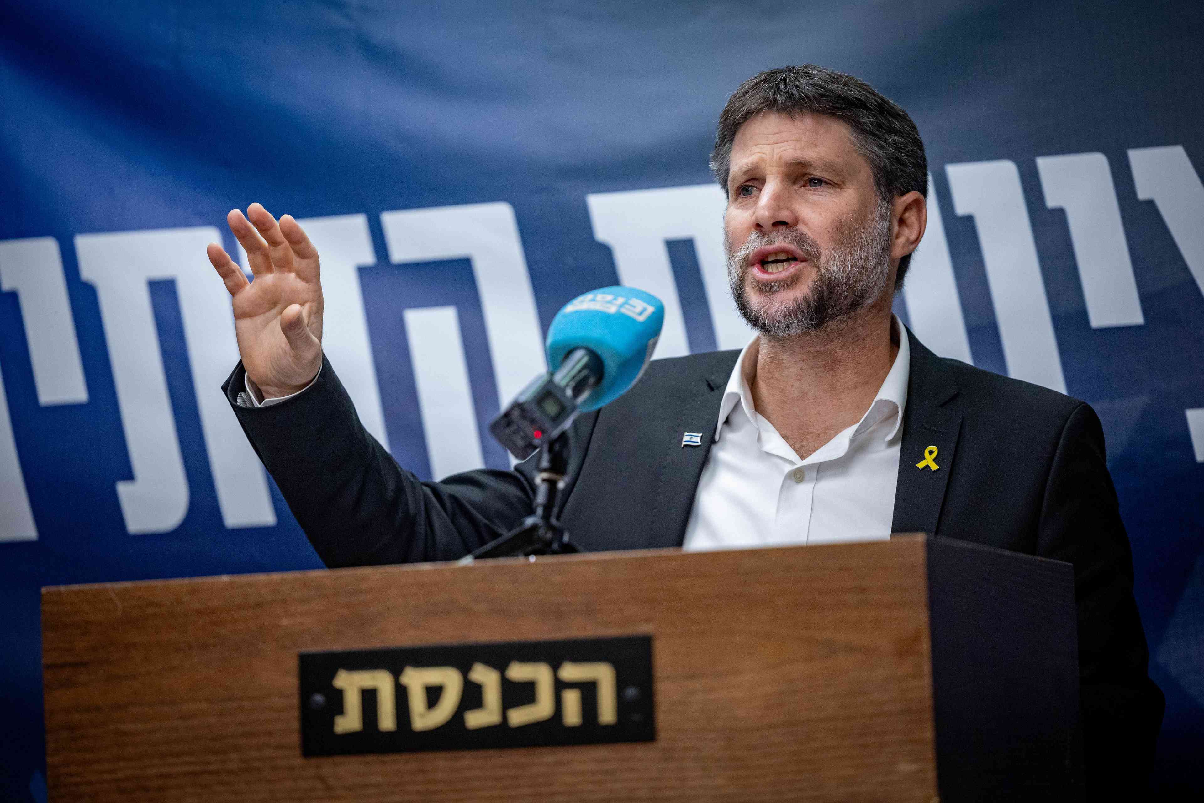 Finance Minister Smotrich. background
