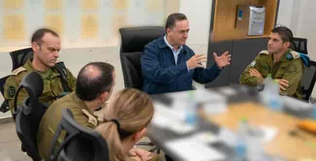 Defense Minister Katz in discussion with IDF forces background