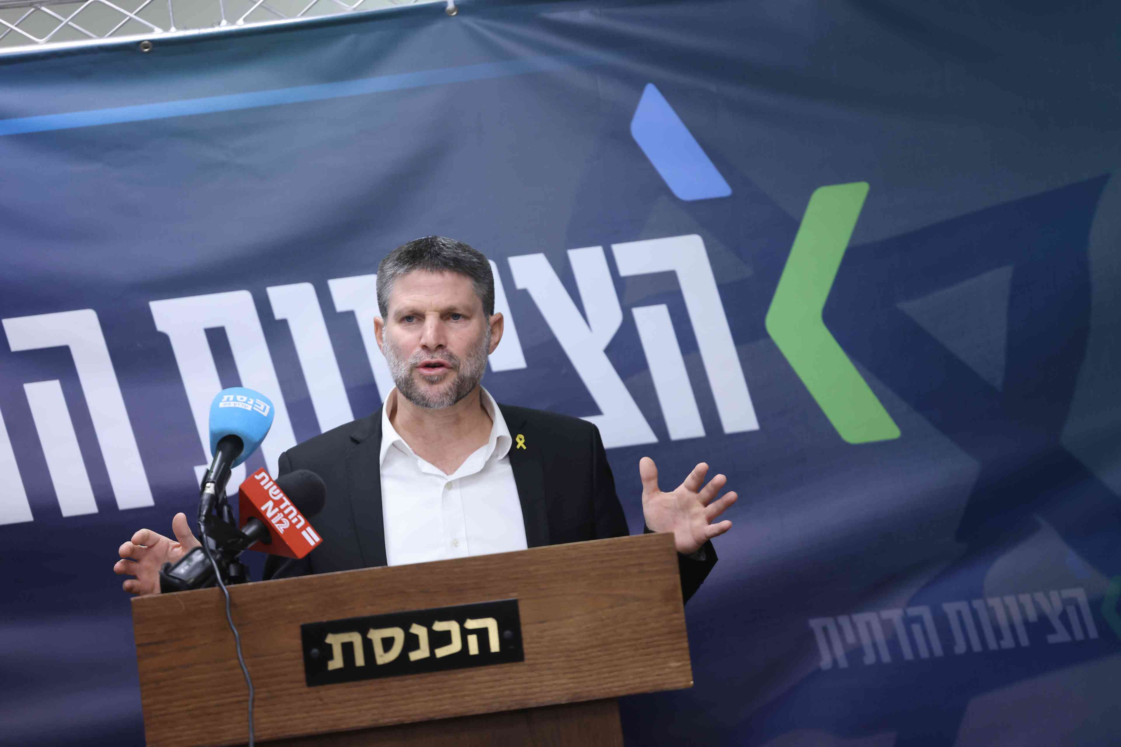 Finance Minister Smotrich. background