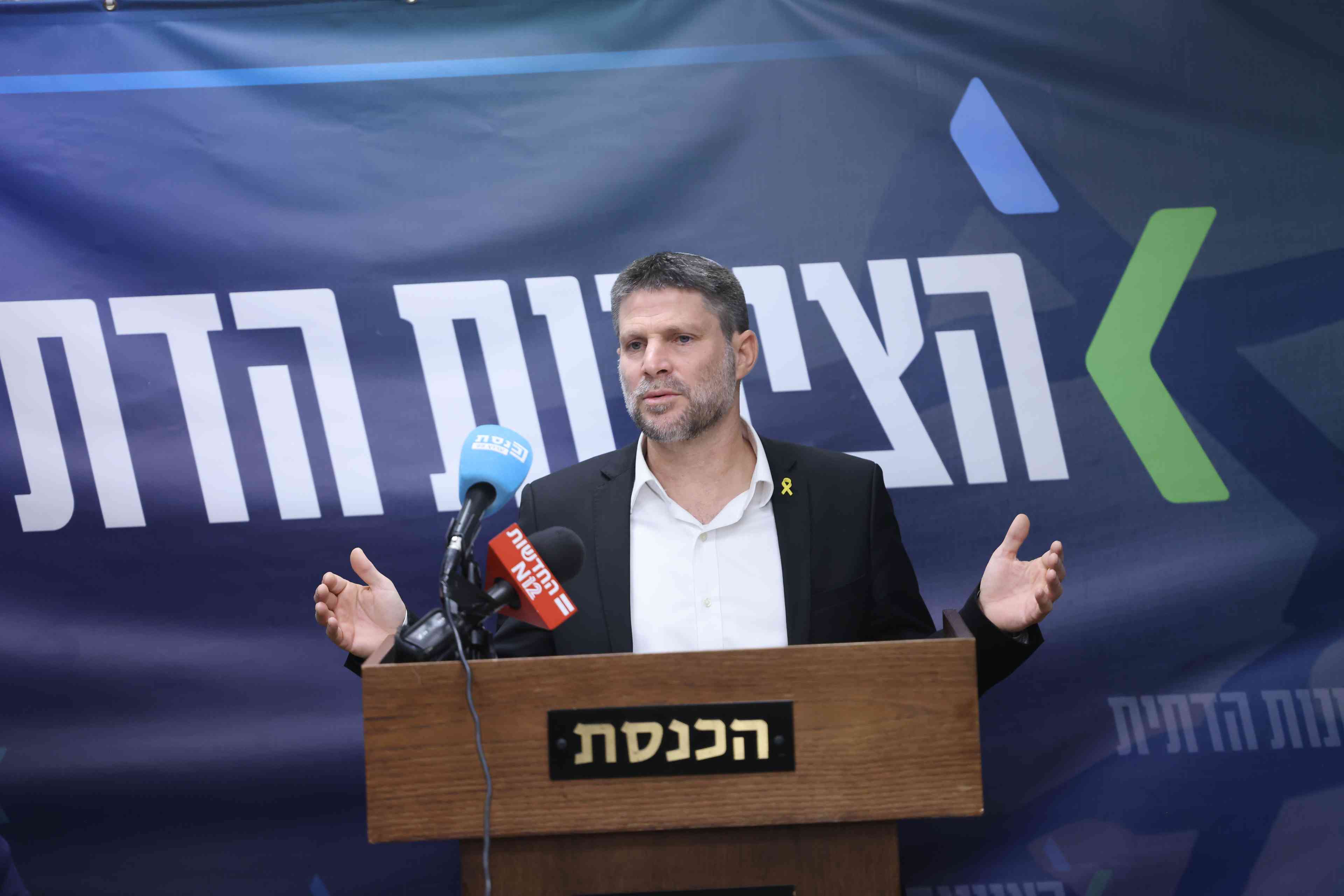 Finance Minister Smotrich. background