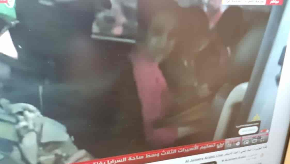 Israeli hostages in the Red Cross vehicle background
