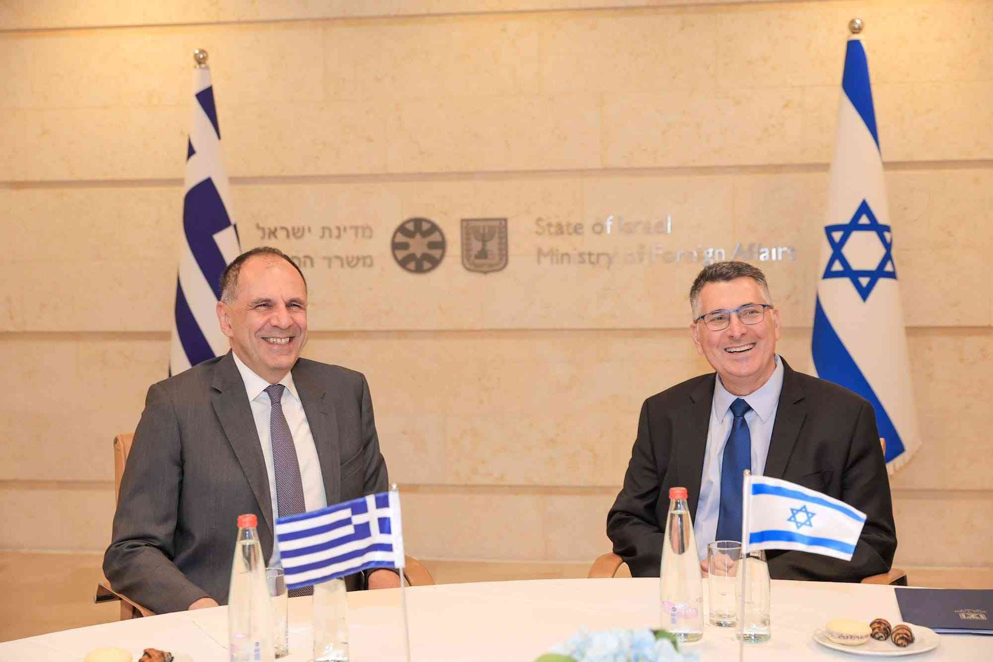 Foreign Minister Gideon Sa'ar and Greek Foreign Minister Giorgos Gerapetritis. background