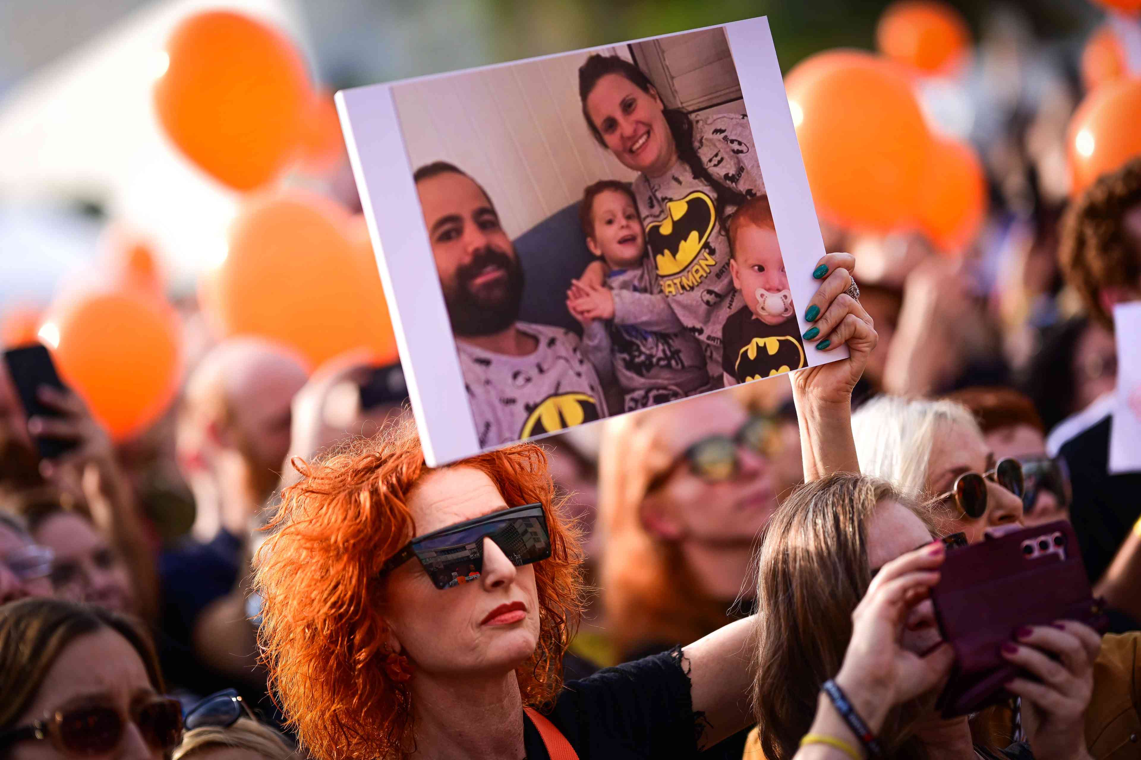 People take part in a protest calling for the release of Bibas family, 10 month old Kfir, 4 year old Ariel, and their parents Shiri and Yarden Bibas, at "Hostage Square" in Tel Aviv