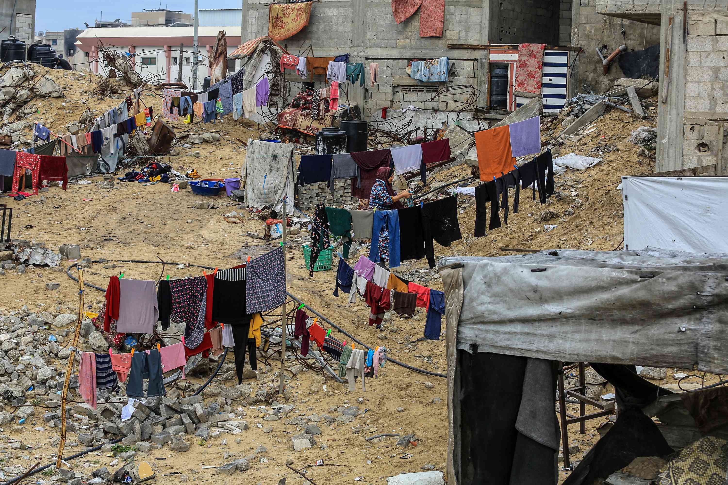 Hanging out laundry in the ruins of the Gaza Strip.