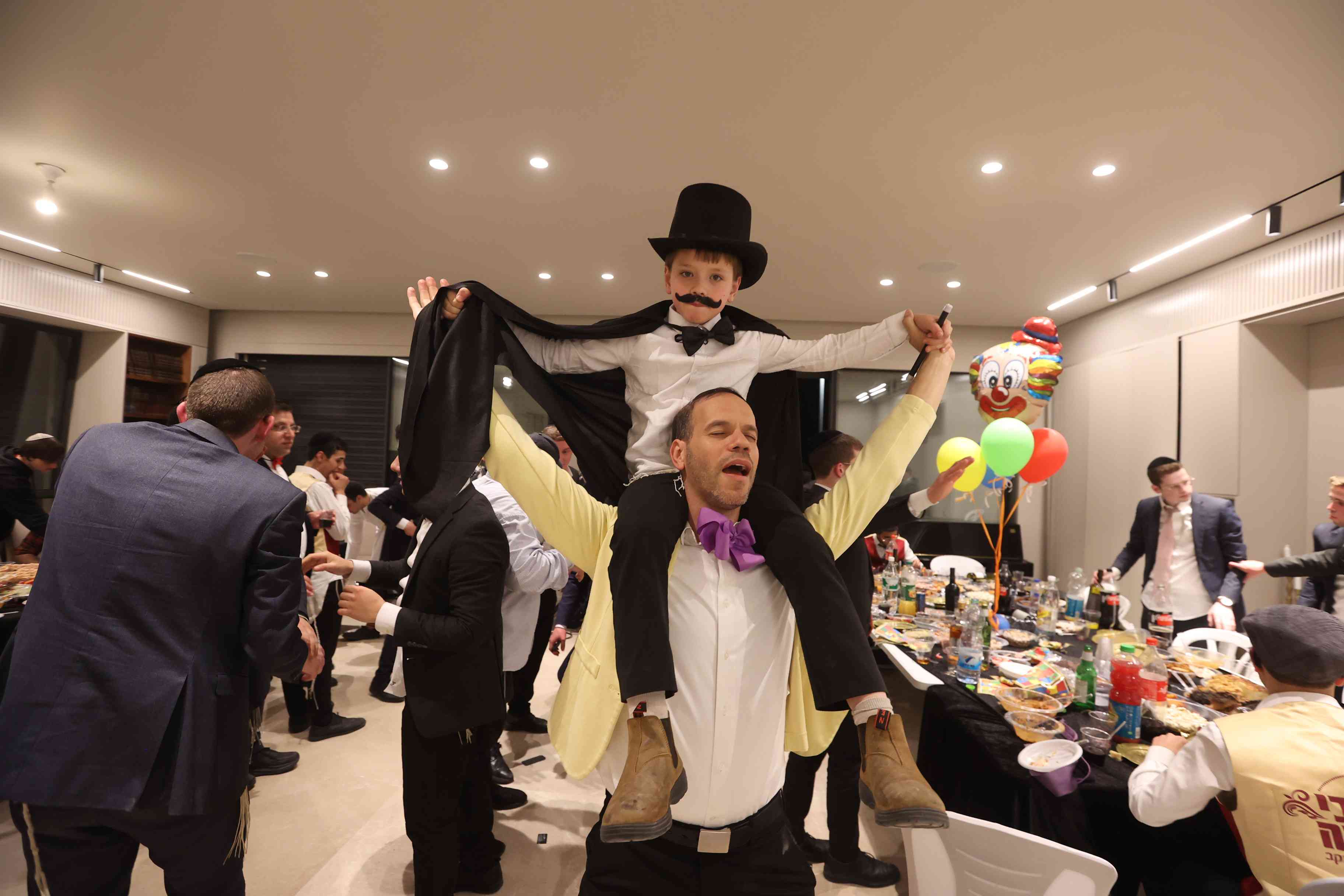 Beit Shemesh Mayor Shmuel Greenberg and Ultra Orthodox jews celebrate the Jewish holiday of Purim, in Beit Shemesh, March 13, 2025. 