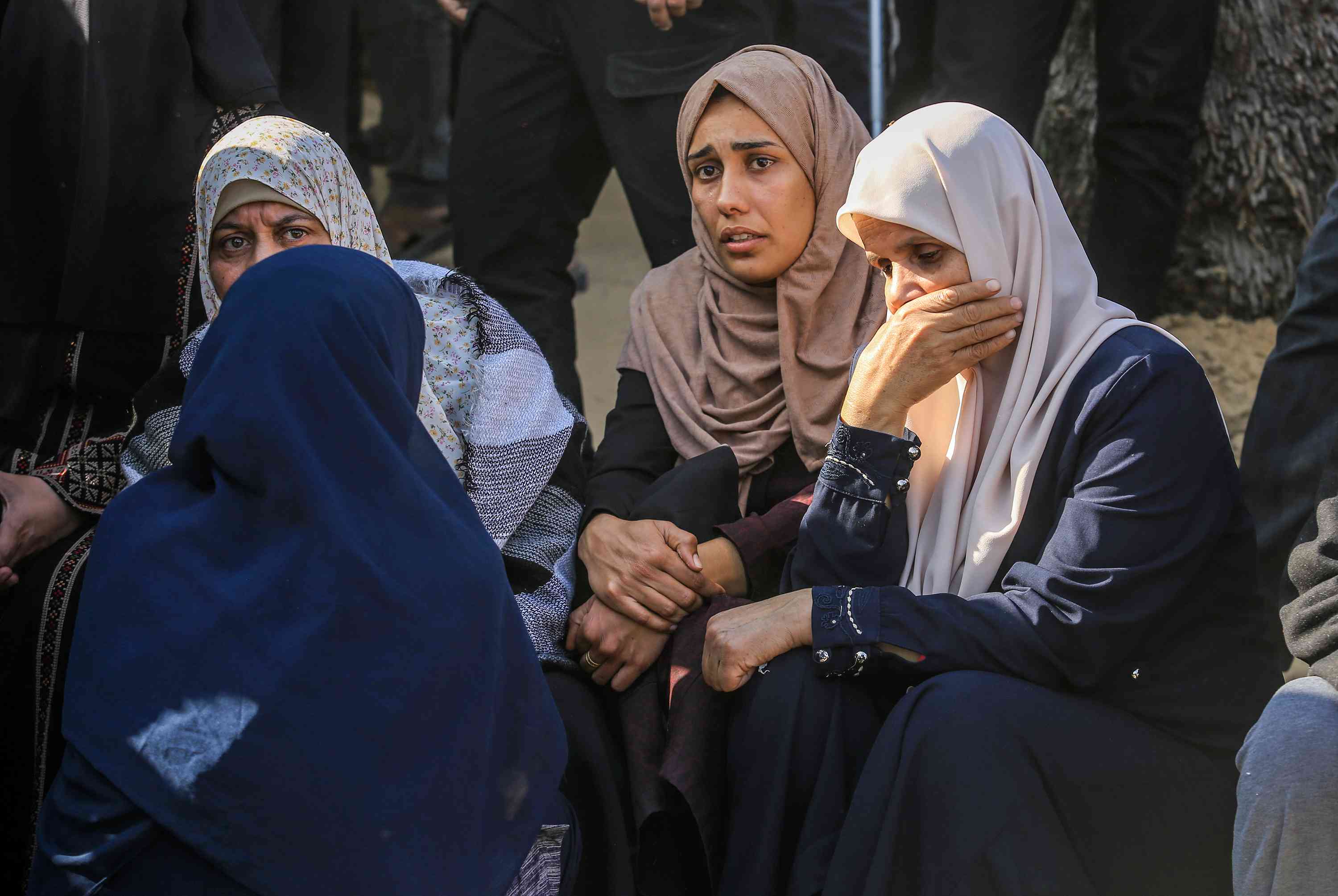 Palestinians mourn the death of Palestinians killed in an Israeli air strike outside the Nasser Hospital in Khan Yunis, in the southern Gaza Strip, March 18, 2025. 