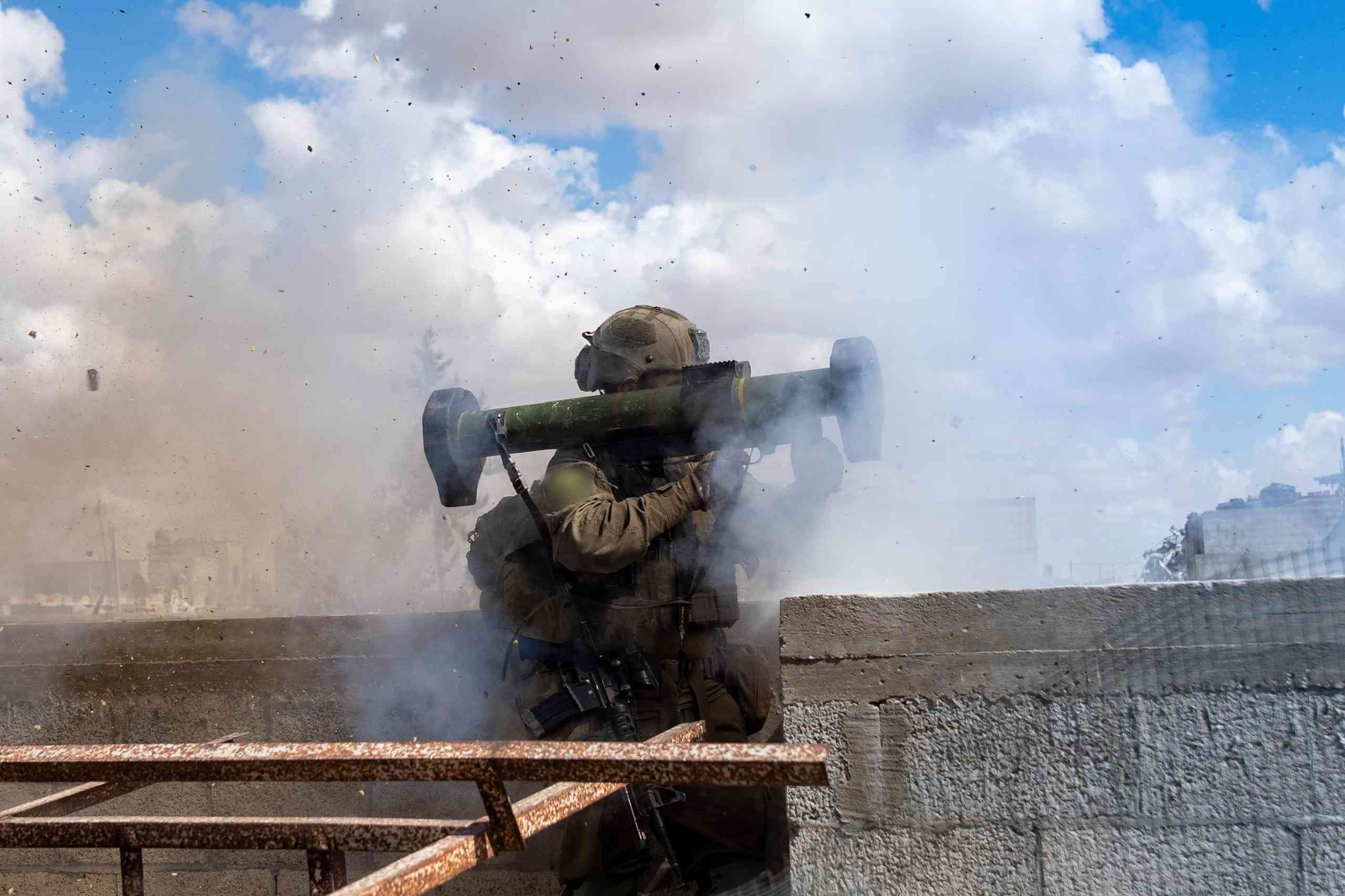 IDF soldier firing a bazooka. background
