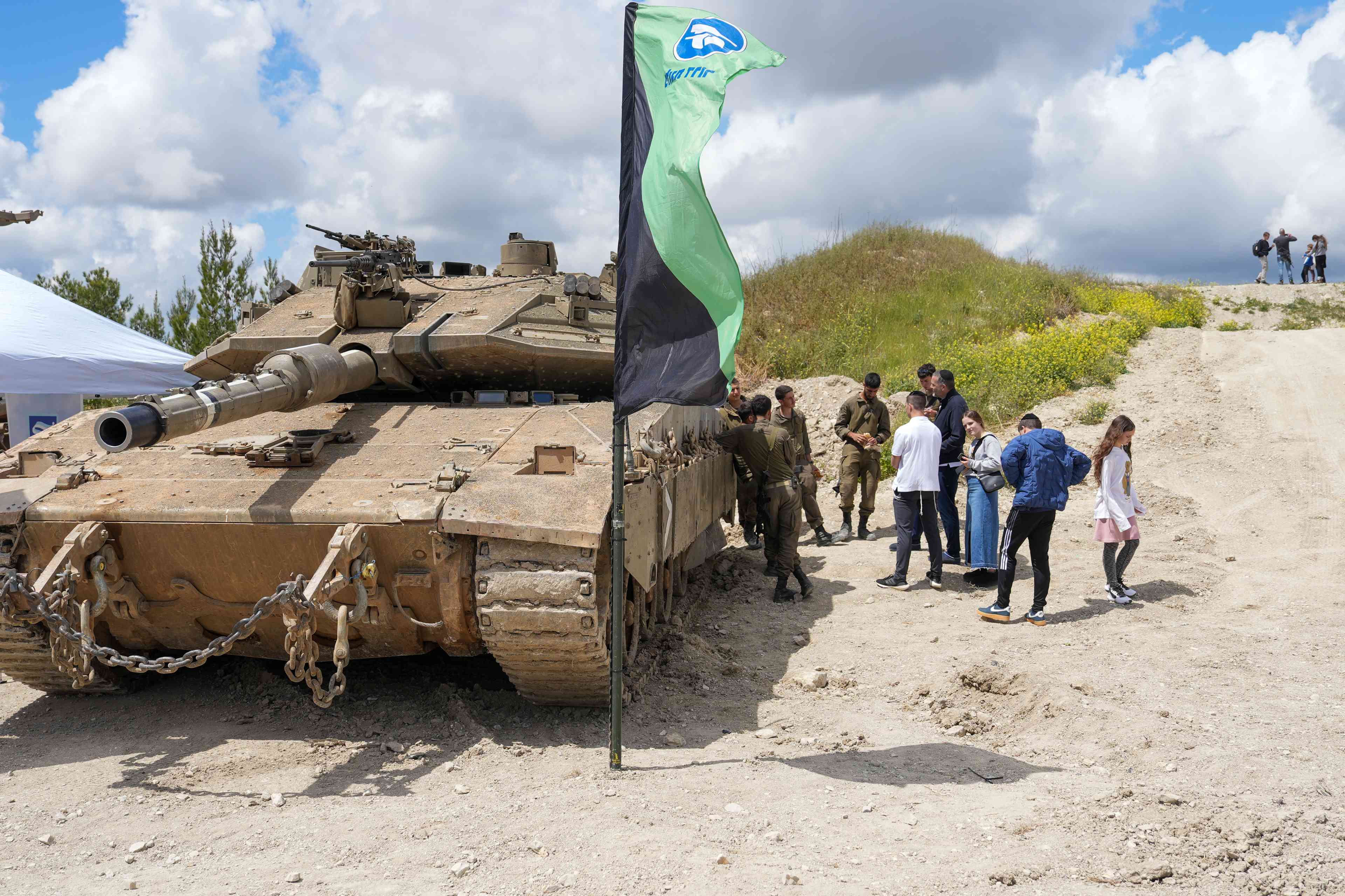 sraelis visit at the Rahimov observatory point with an IDF display of military tools and explanations. April 14, 2025. background