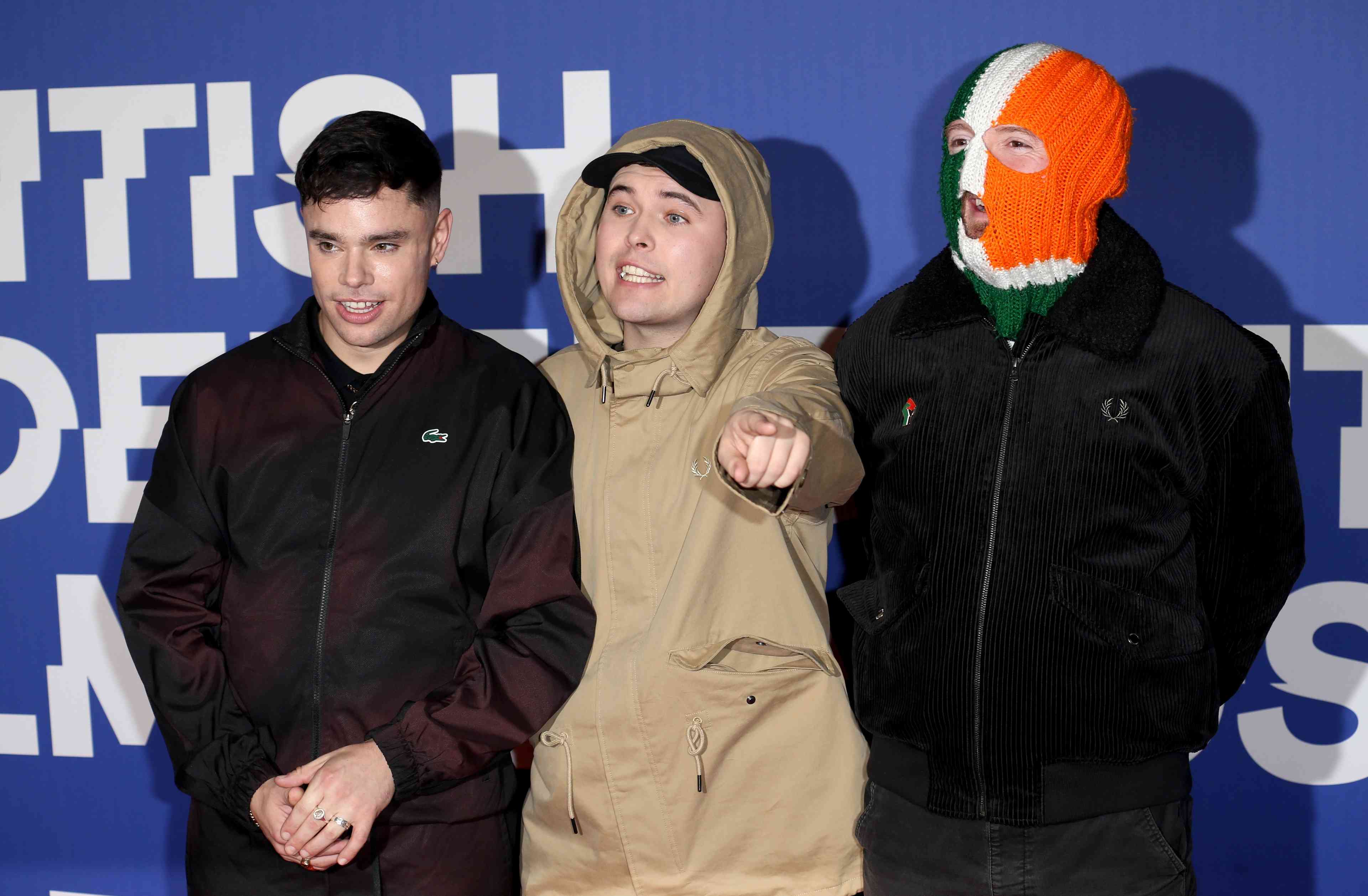 Liam Óg Ó Hannaidh, Naoise Ó Cairealláin and JJ Ó Dochartaigh of Kneecap attend the 27th British Independent Film Awards at The Roundhouse in London background