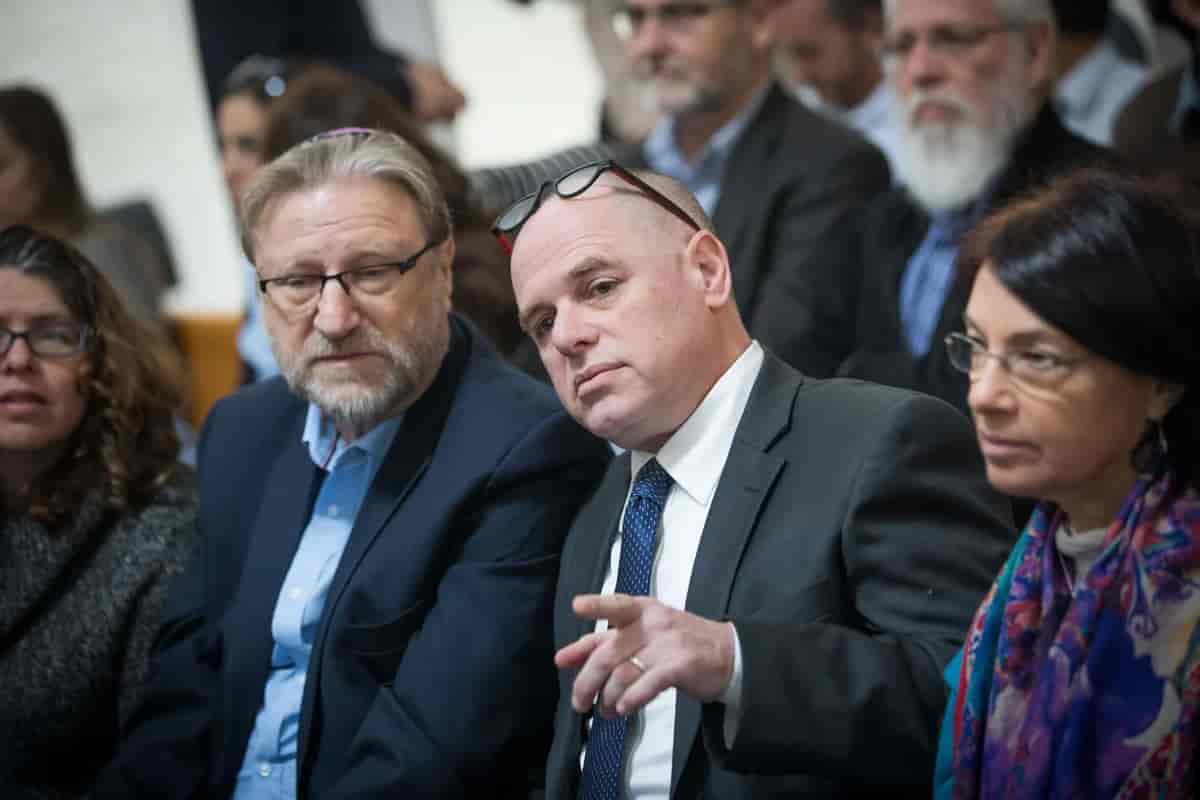 Member of the board of the World Center organization, Mr. Yizhar Hess, alongside the organization's CEO, Mr. Mauricio Beltr, in a High Court discussion on the 'Western Wall outline'. background