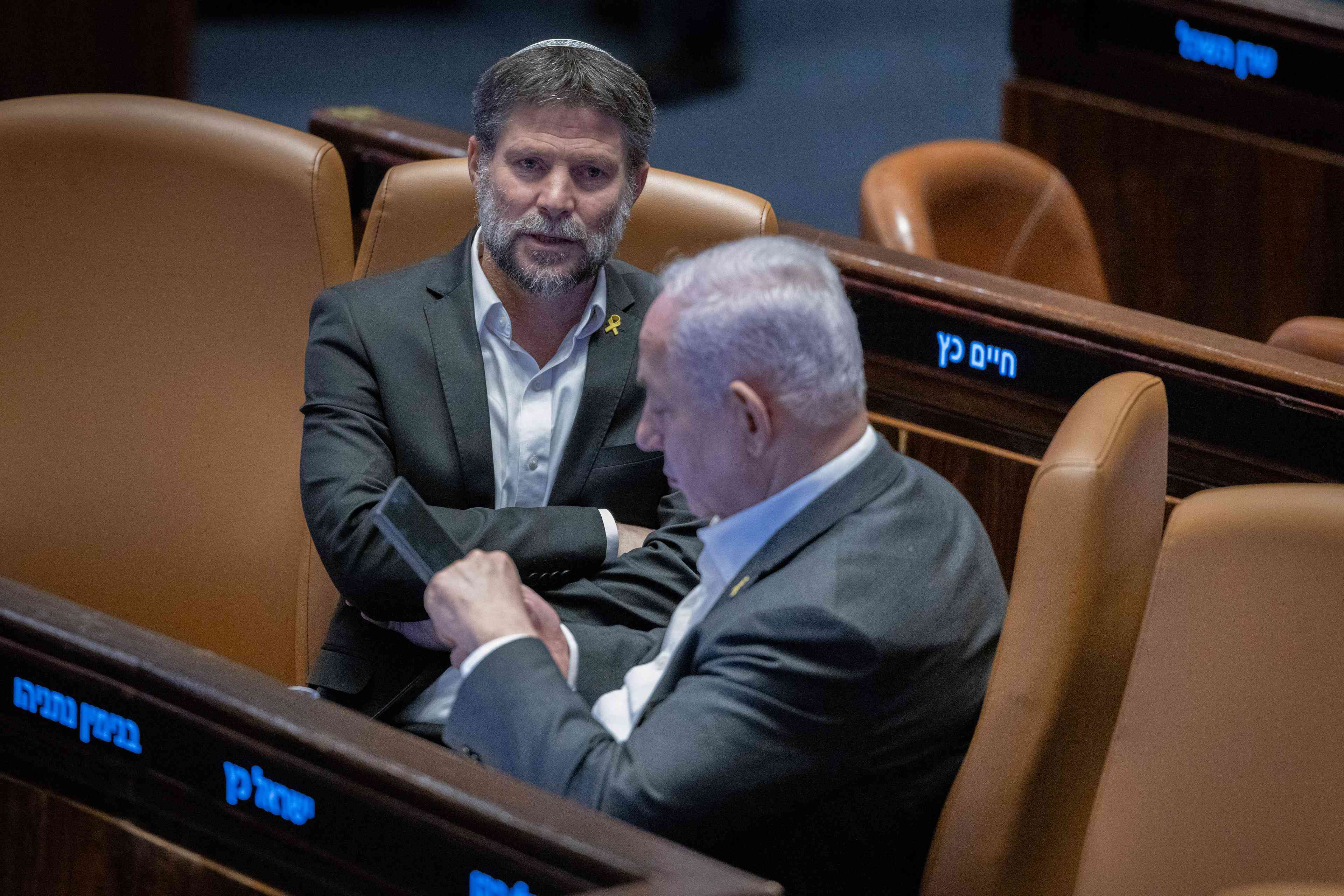 Smotrich and Netanyahu. background