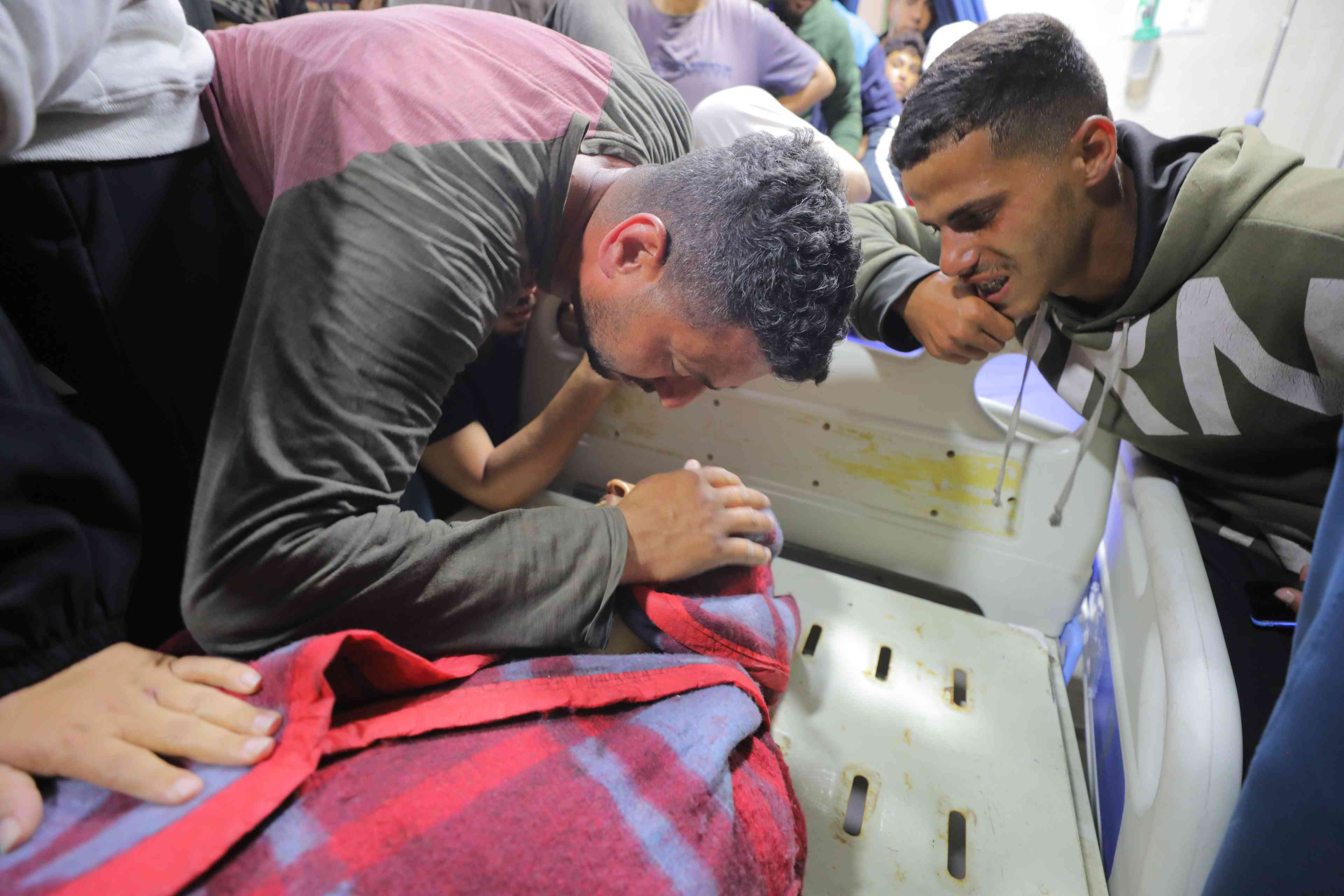 Palestinians pay their last respects to children killed in Israeli airstrikes on the Nuseirat refugee camp. April 22,2025. background
