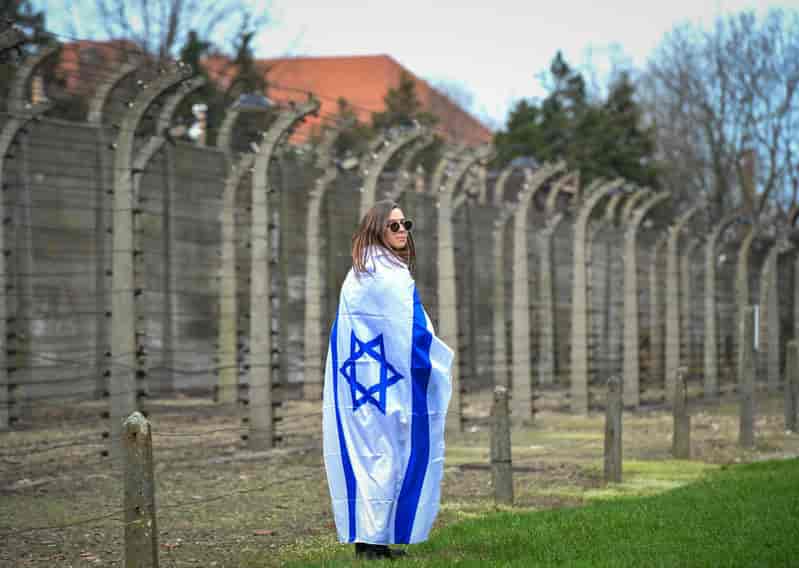 At Auschwitz background